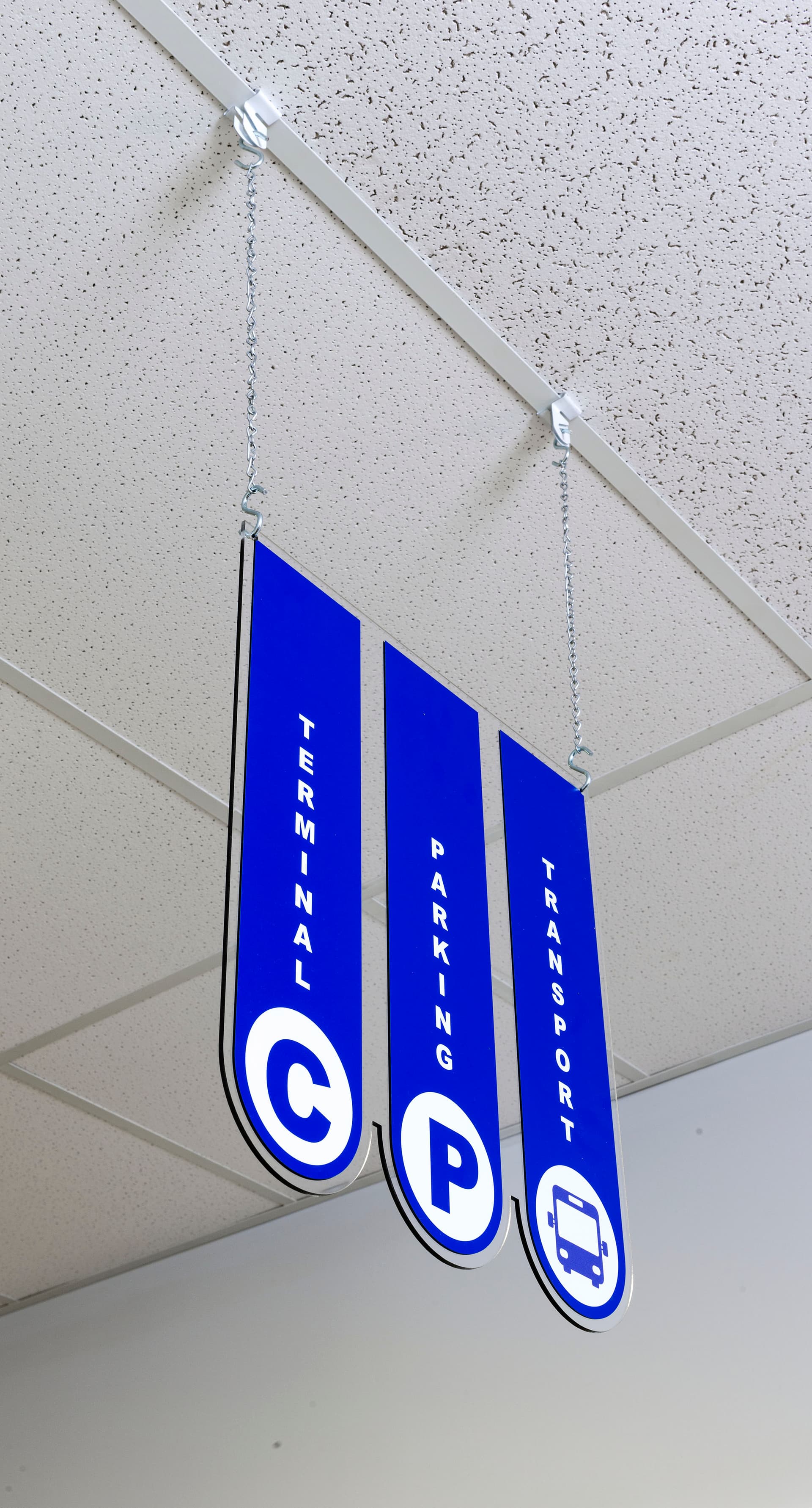 Ceiling hanging directional signage with 0.25 inch acrylic