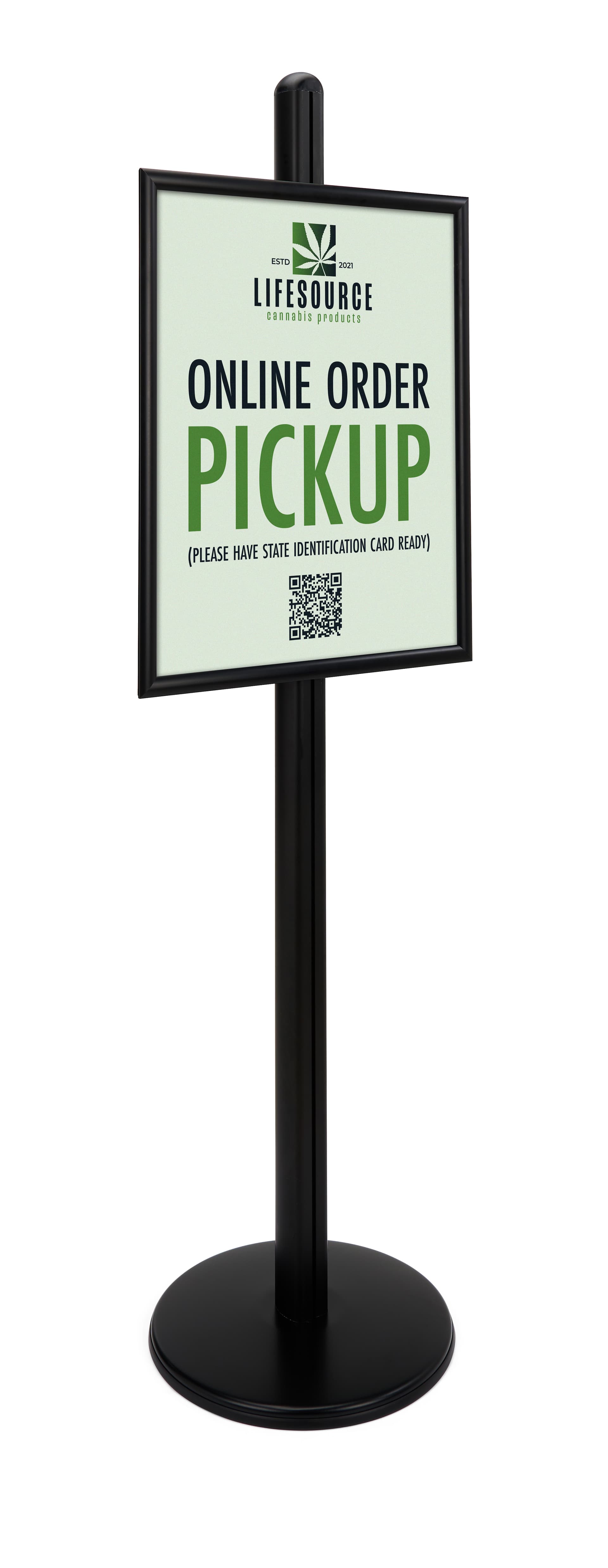 Sign display with black pole and base