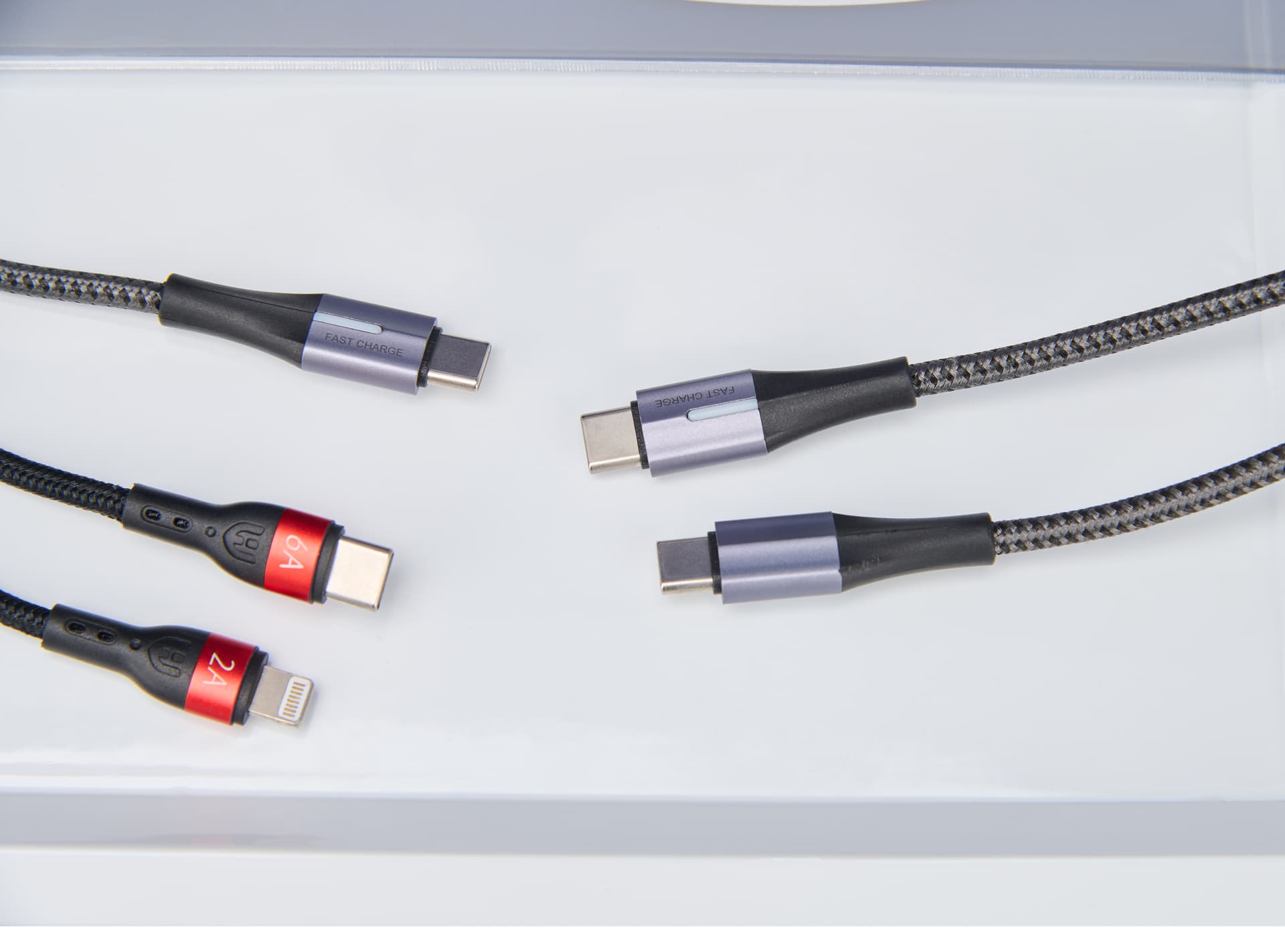 Cell phone charging station showing up close view of four USB-C cables and 1 lightning cable