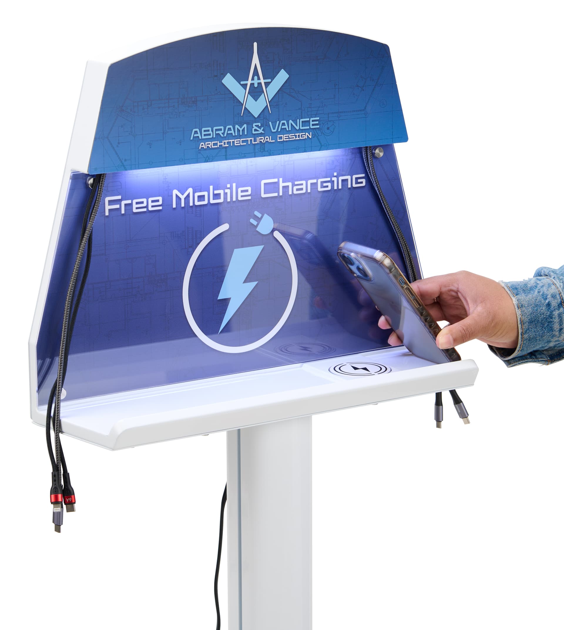 Close up of cell phone charging station with phone being placed on wireless charging pad