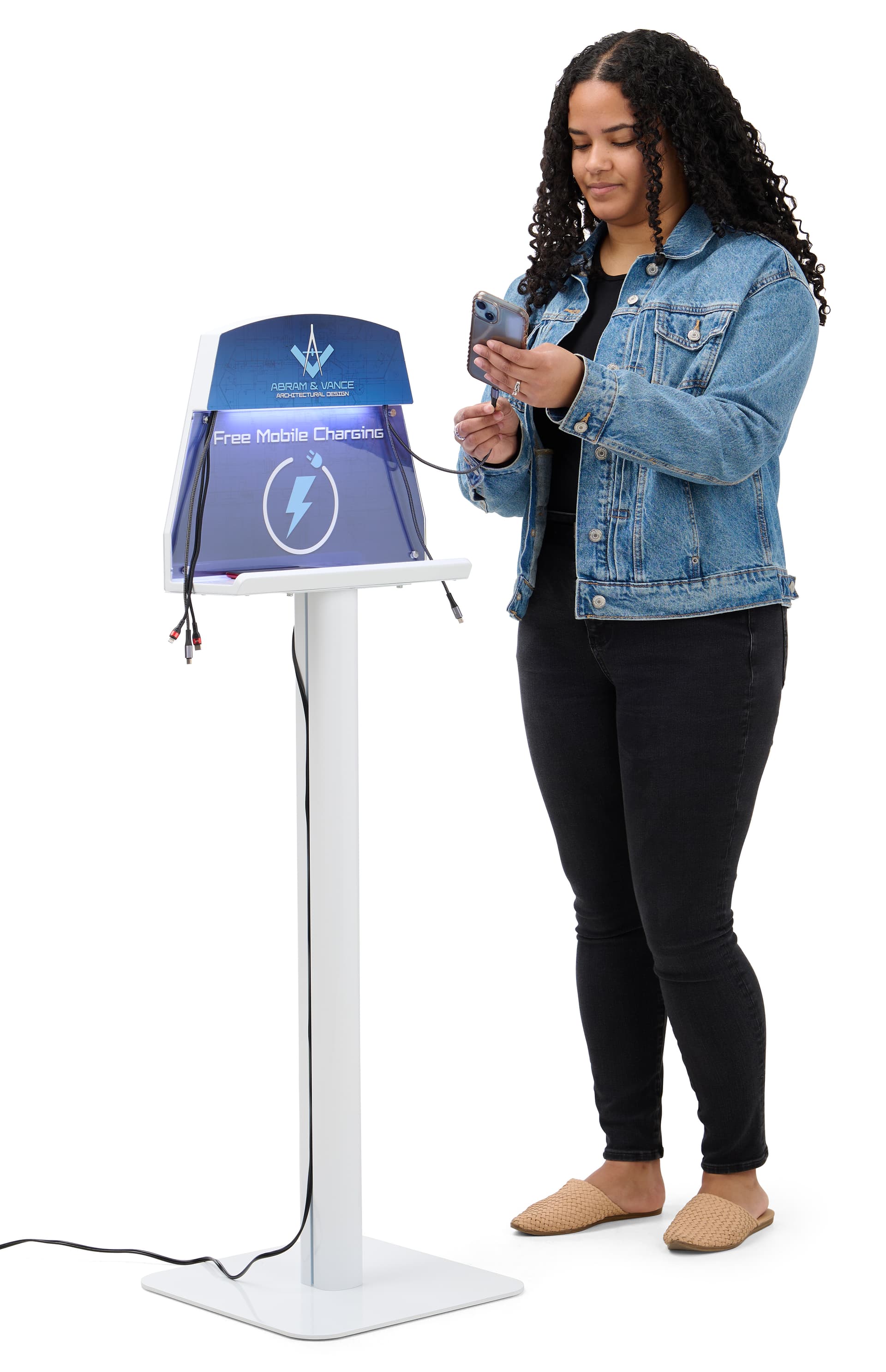 Person plugging in device on cell phone charging station