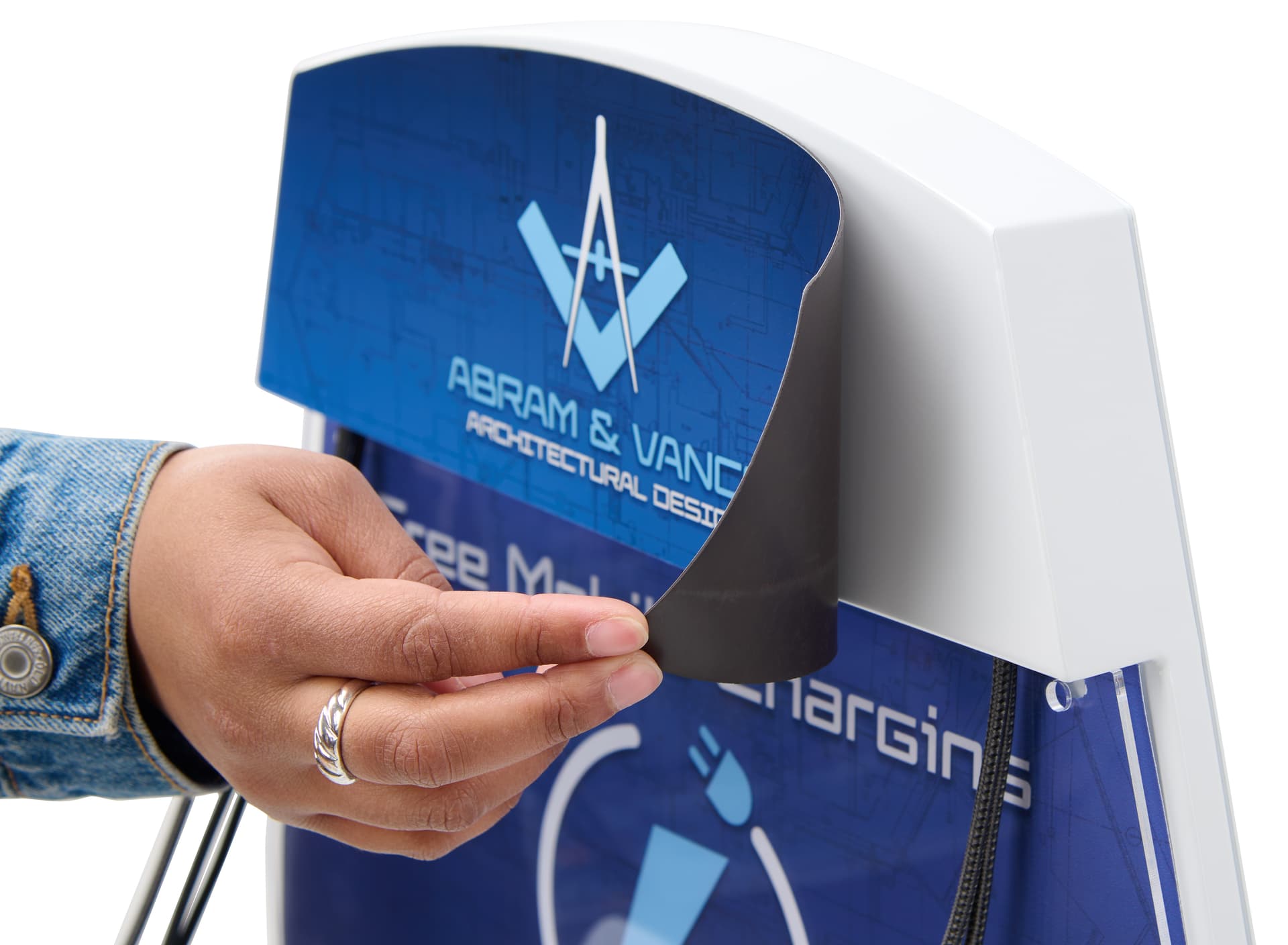 Cell phone charging station with magnetic graphic being pulled off unit