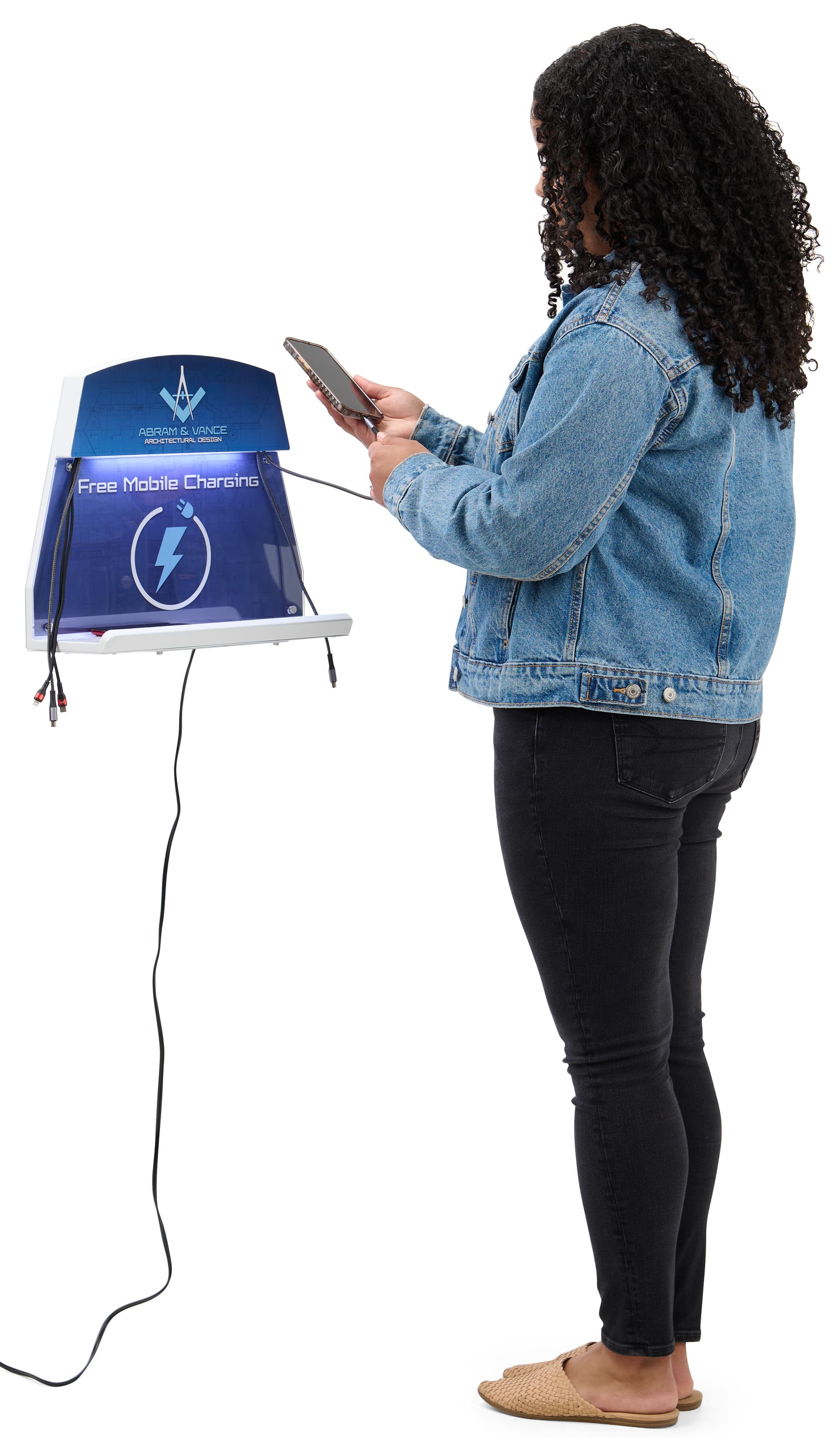 Person using wall mounted cell phone charging station