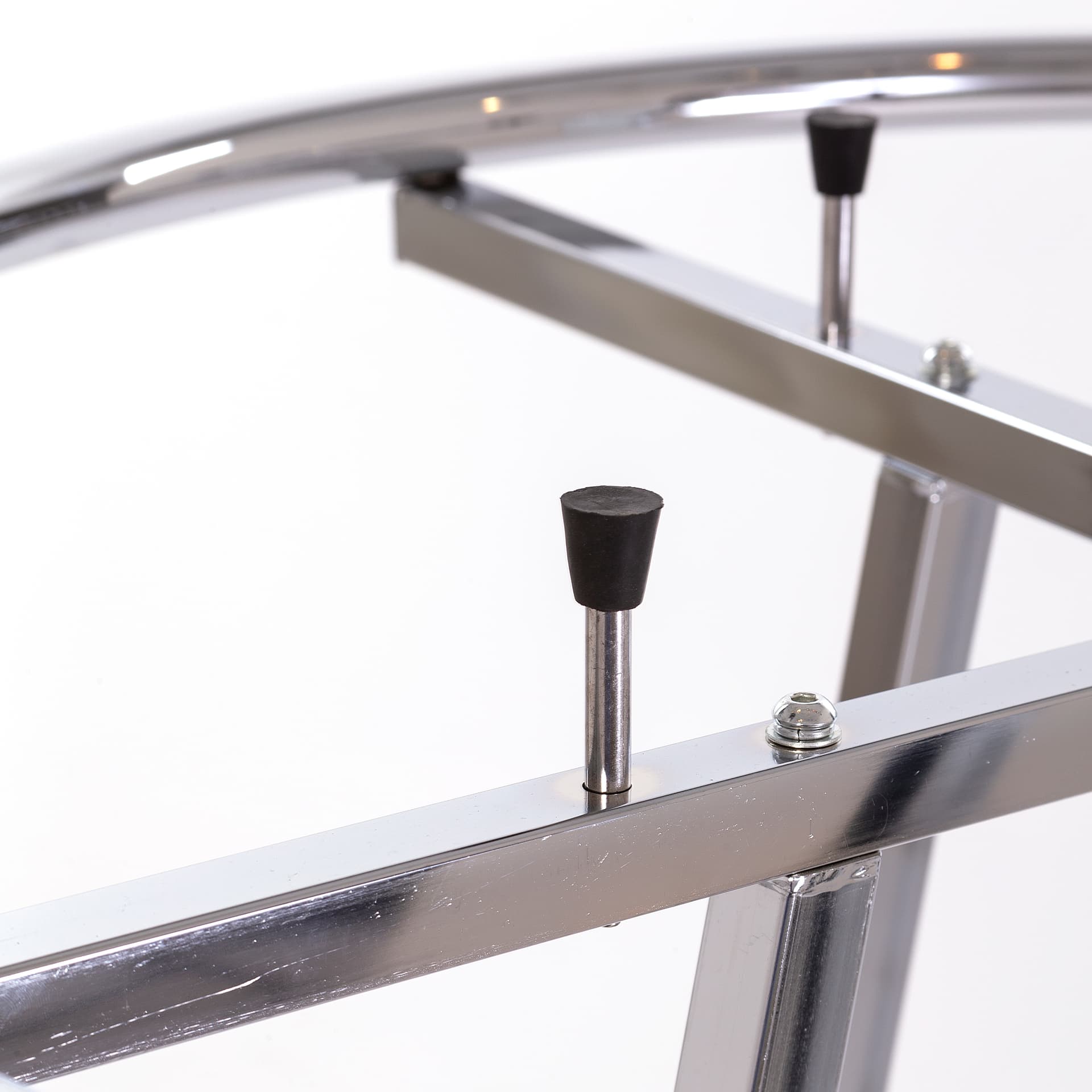 Round clothing rack with rubber tipped shelf supports