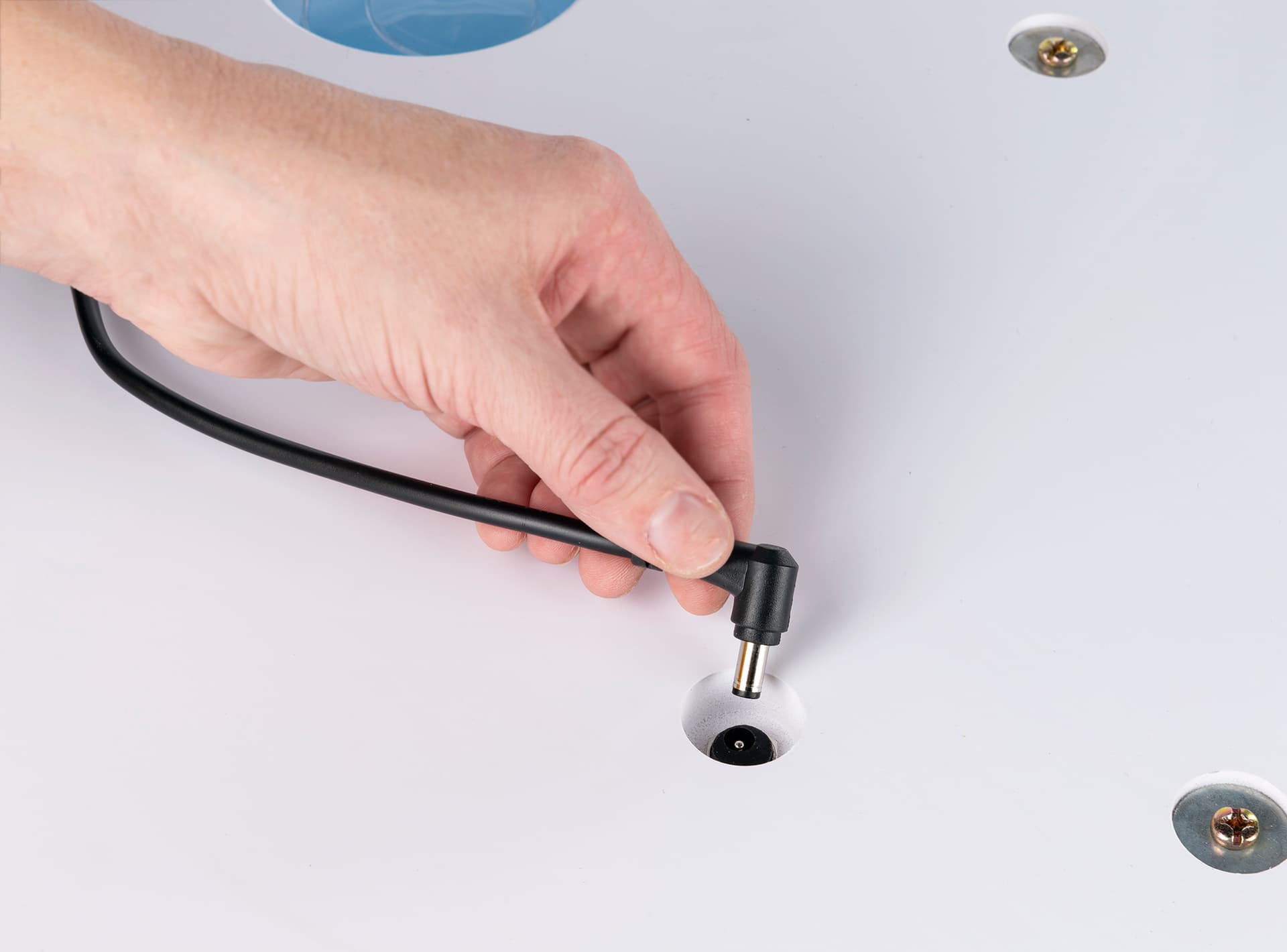 Connection to power supply on base of air inflatable backlit rectangular counter