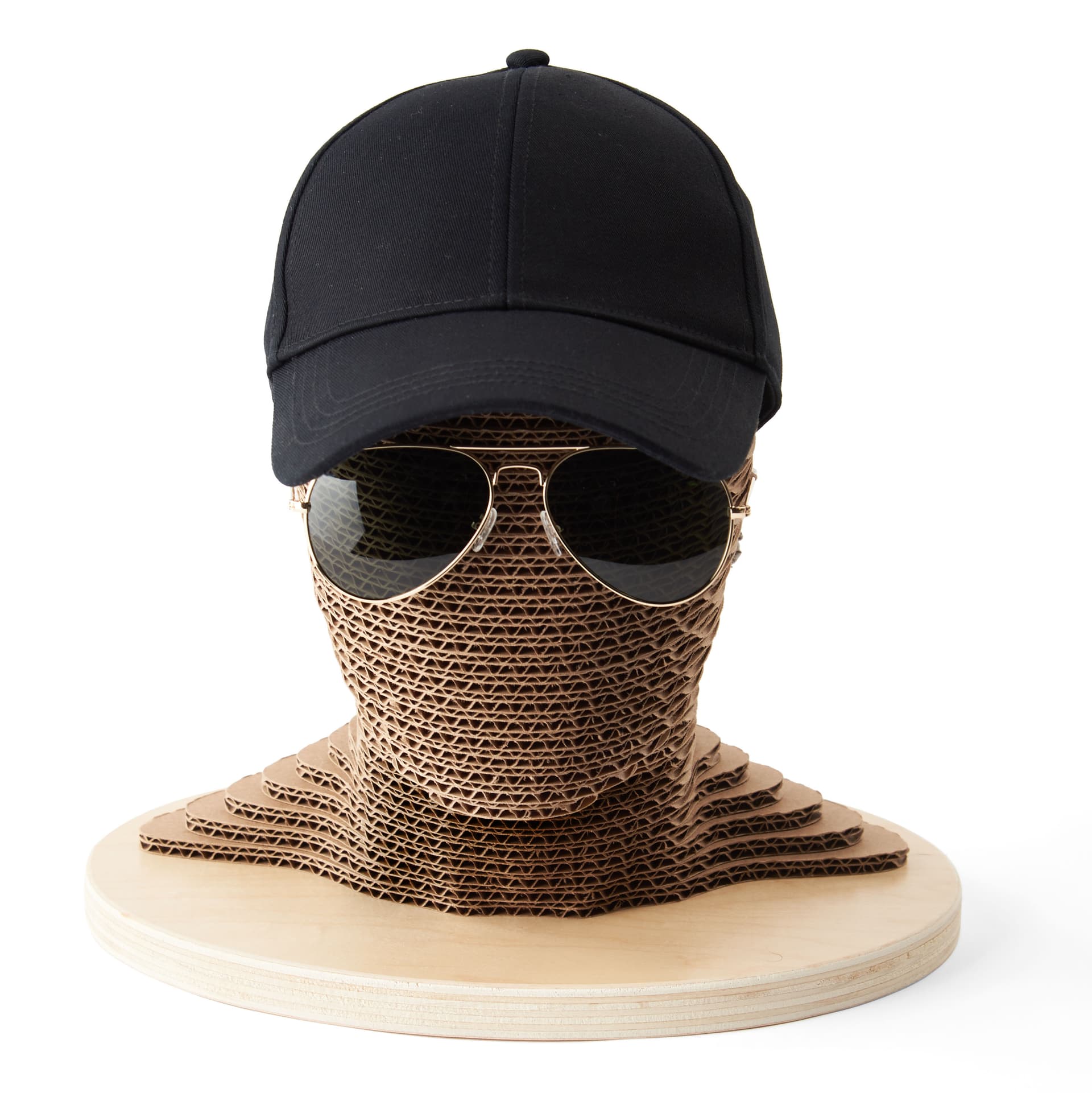Cardboard mannequin head with abstract facial features 