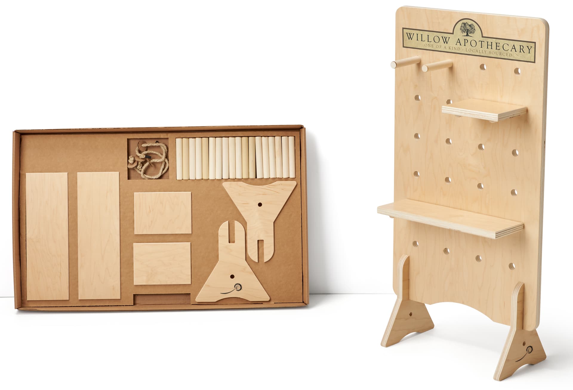 Pegboard retail display with flat-pack carrying case 
