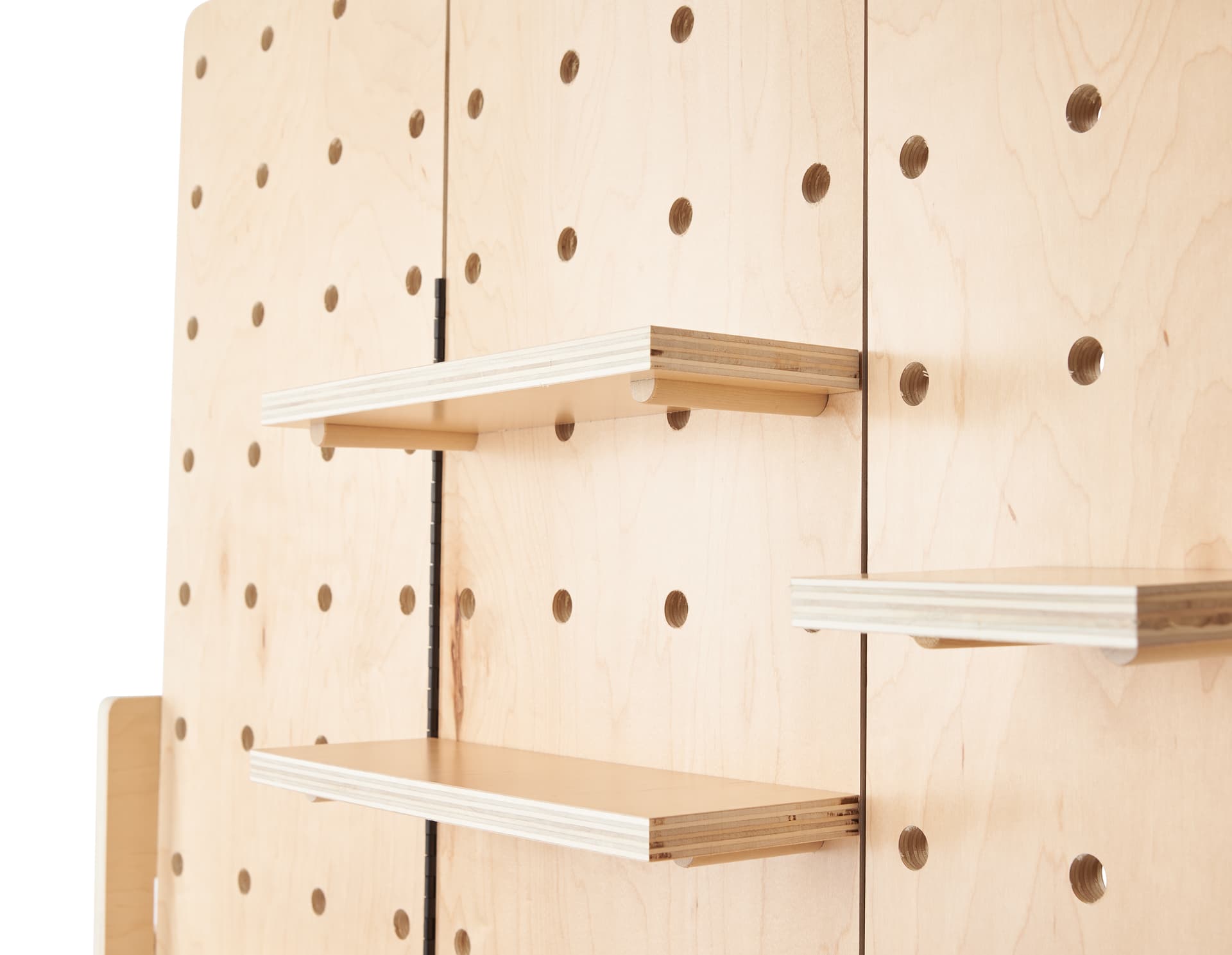 Folding pegboard display with 12 shelves of varying sizes