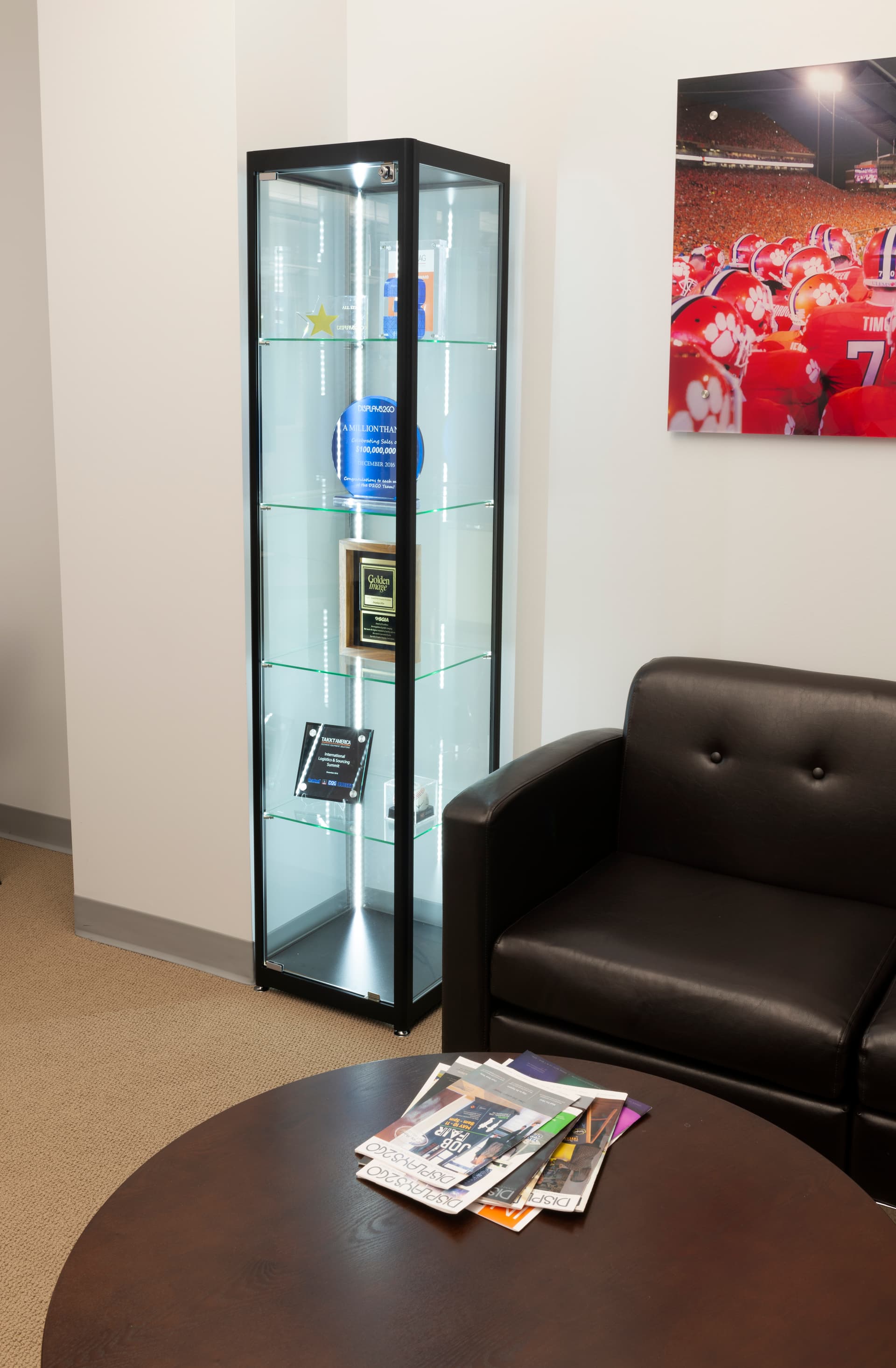 brightly-lit glass curio cabinet display tower