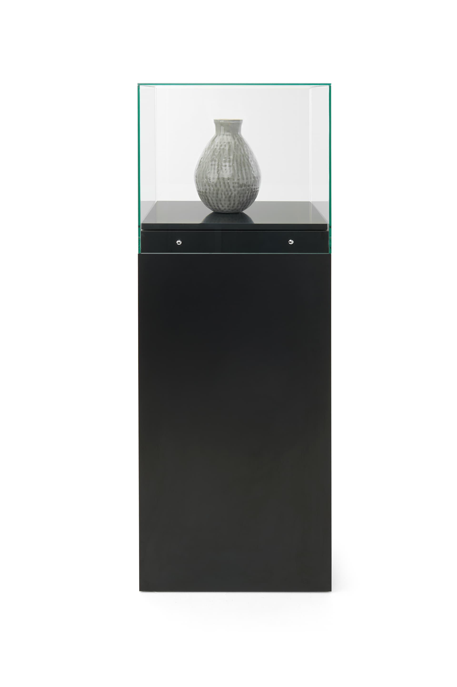 Glass-top pedestal display case with with chrome embellishment