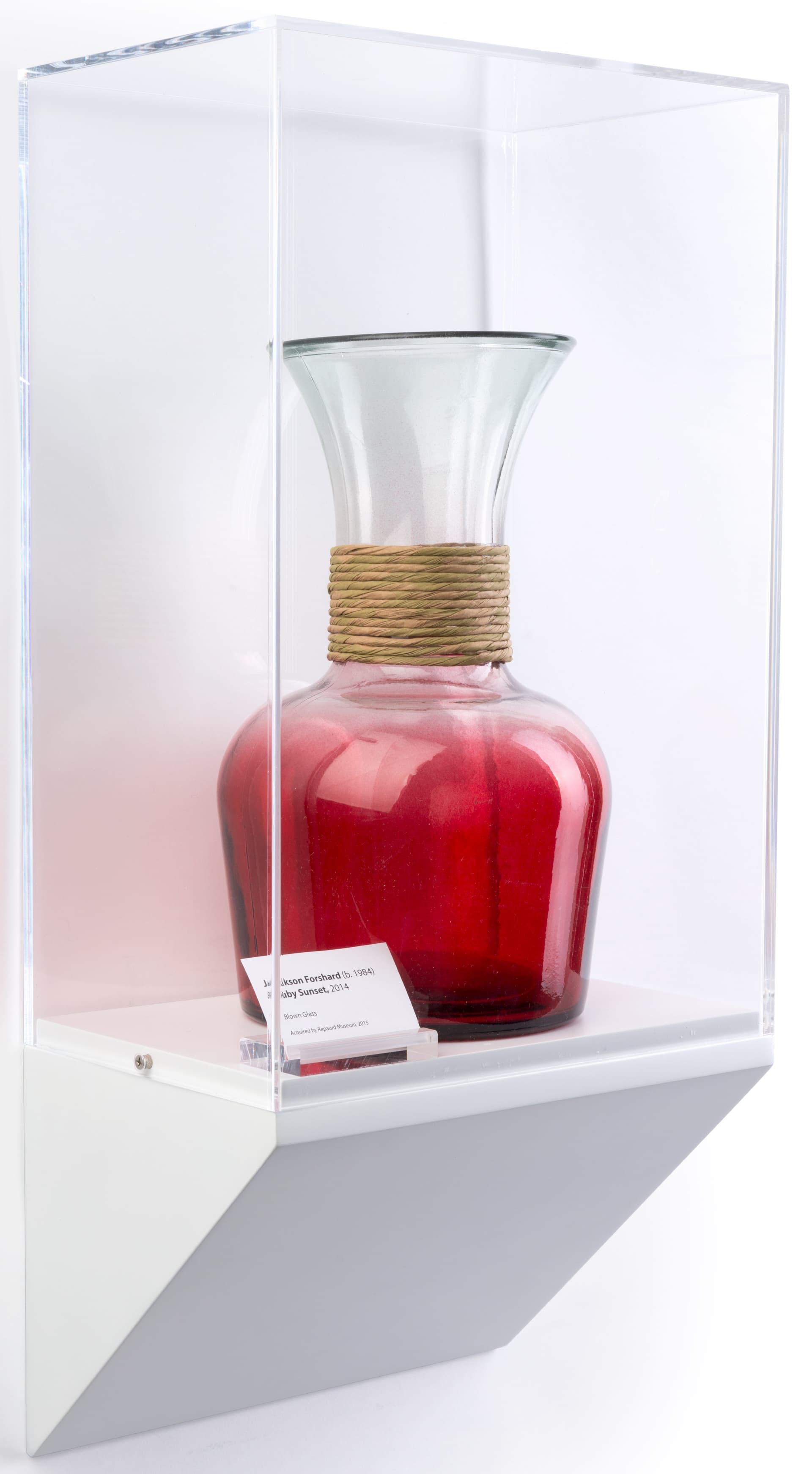 Wedge pedestal museum wall case shown with vase