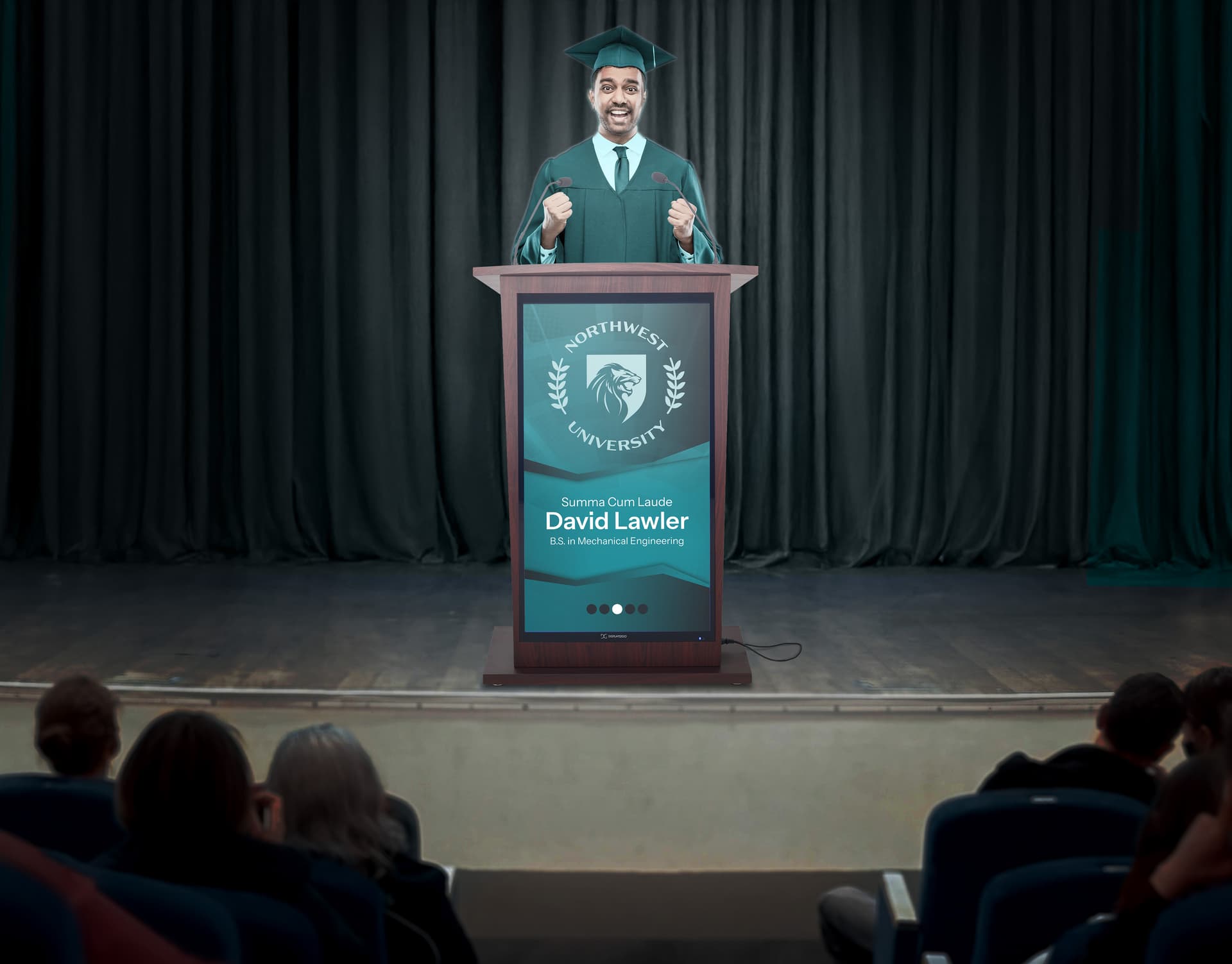 Digital podium being utilized in an auditorium during a graduation ceremony