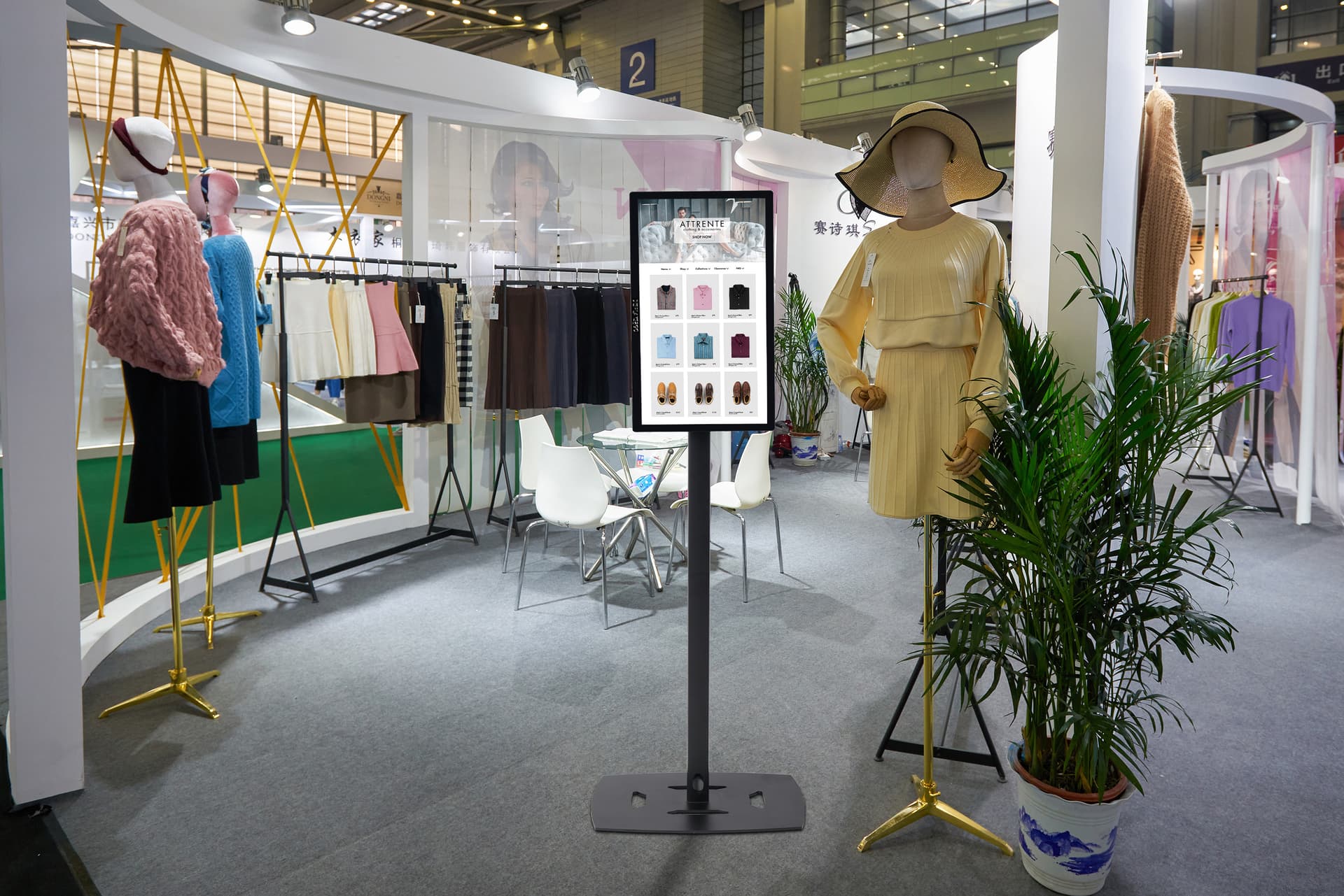 Commercial touch screen display being utilized in a retail trade show to display a clothing companies website