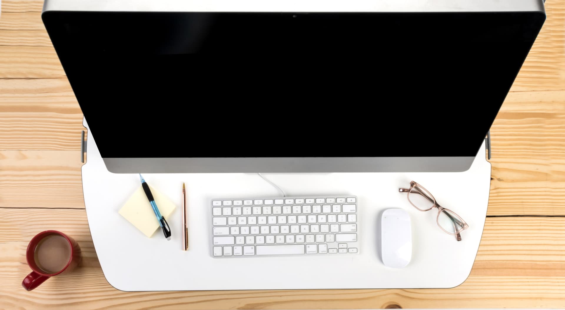 Height adjustable standing desk converter that elevates up to 15.75"