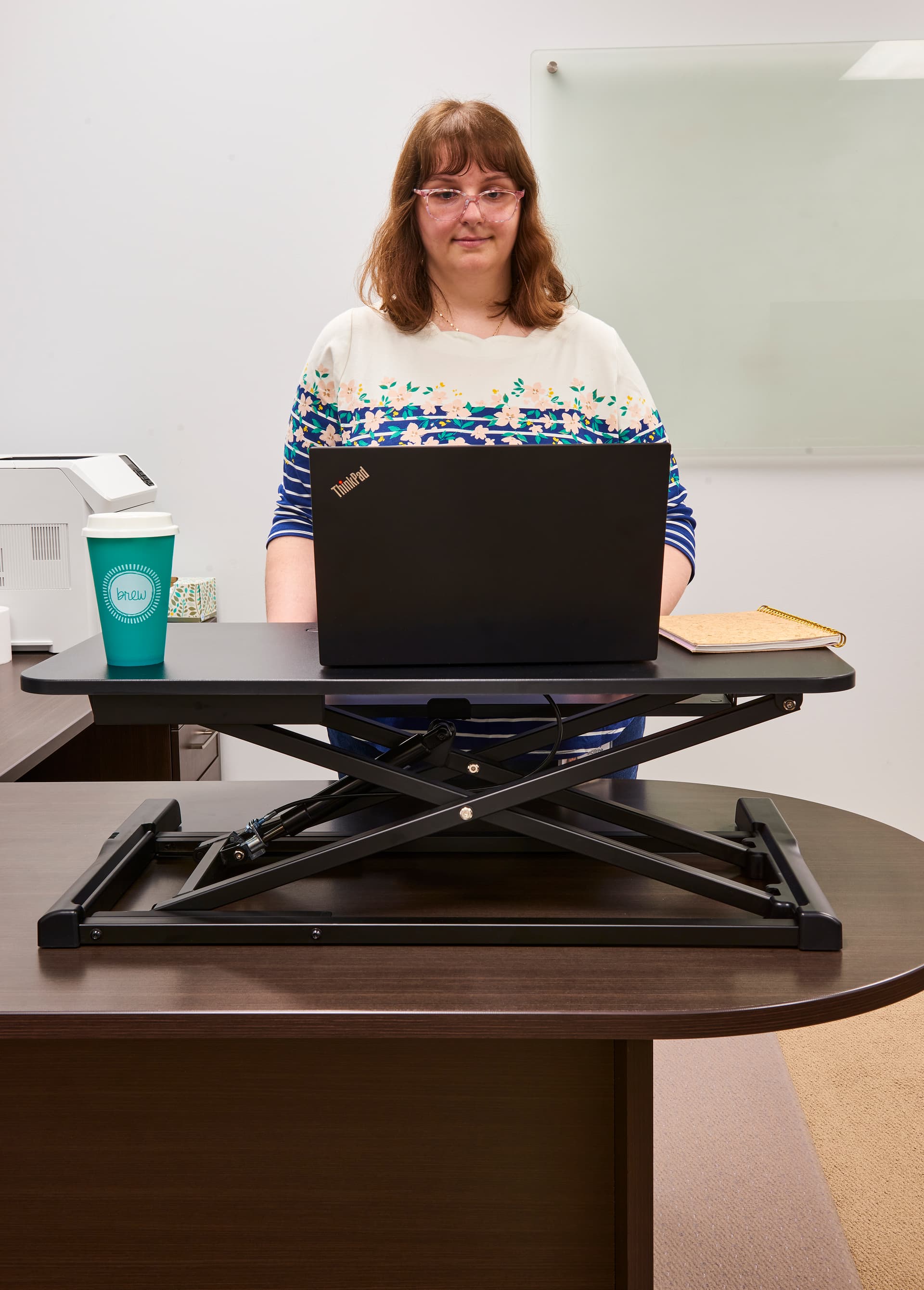 Gas-lift sit-stand desk converter promotes body movement 
