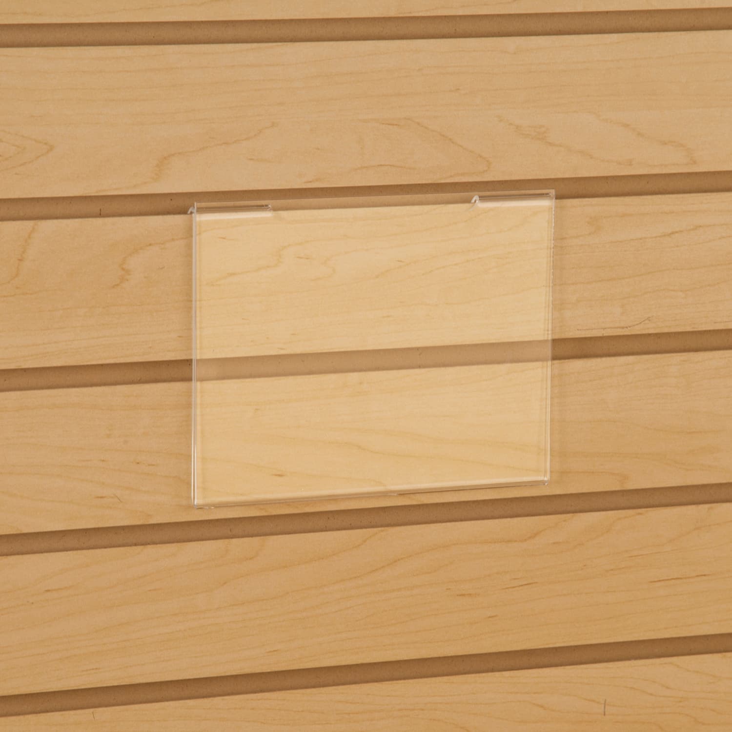 Acrylic gridwall sign holder being shown on a slatwall