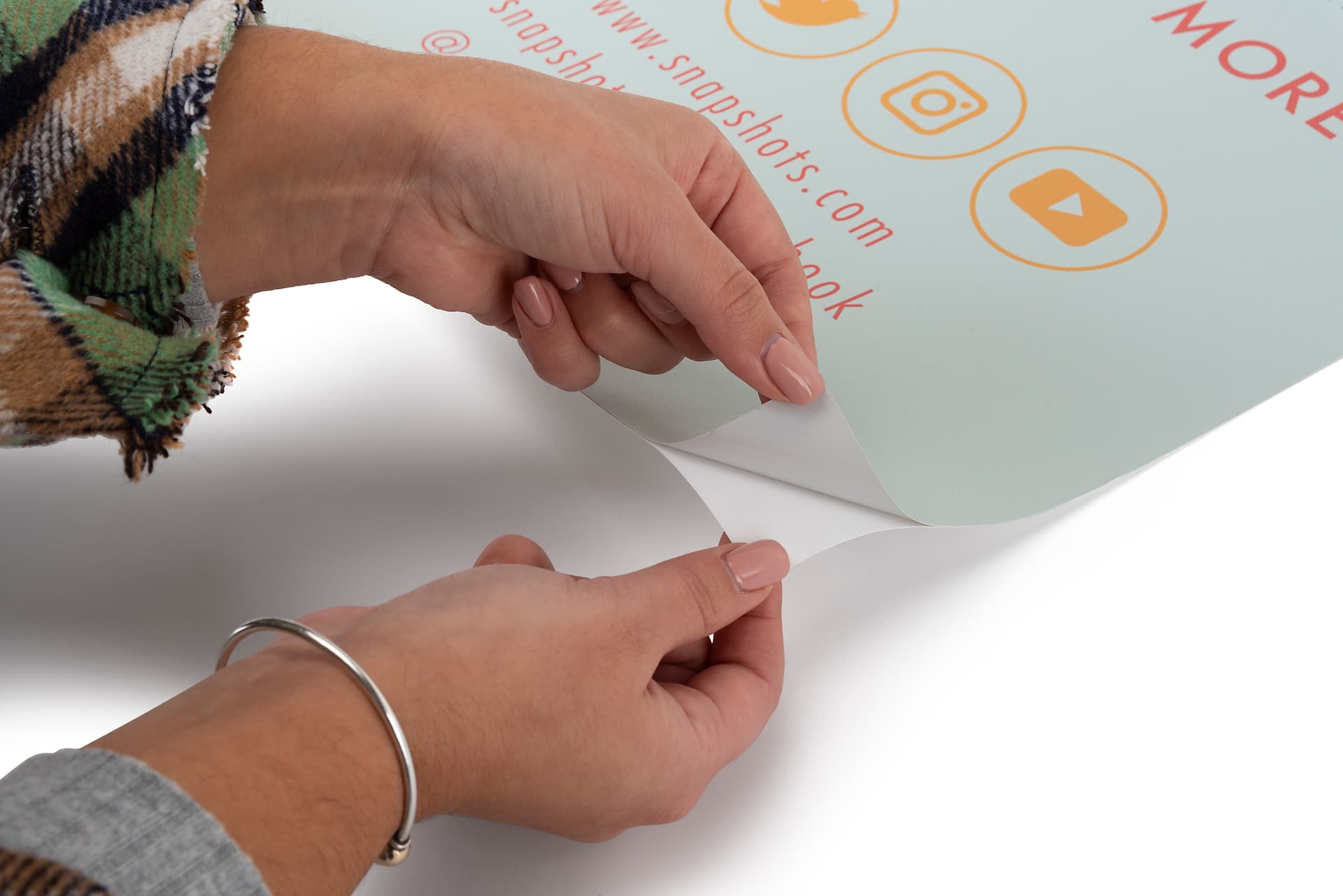 Custom graphic label for traveling case has adhesive backing 