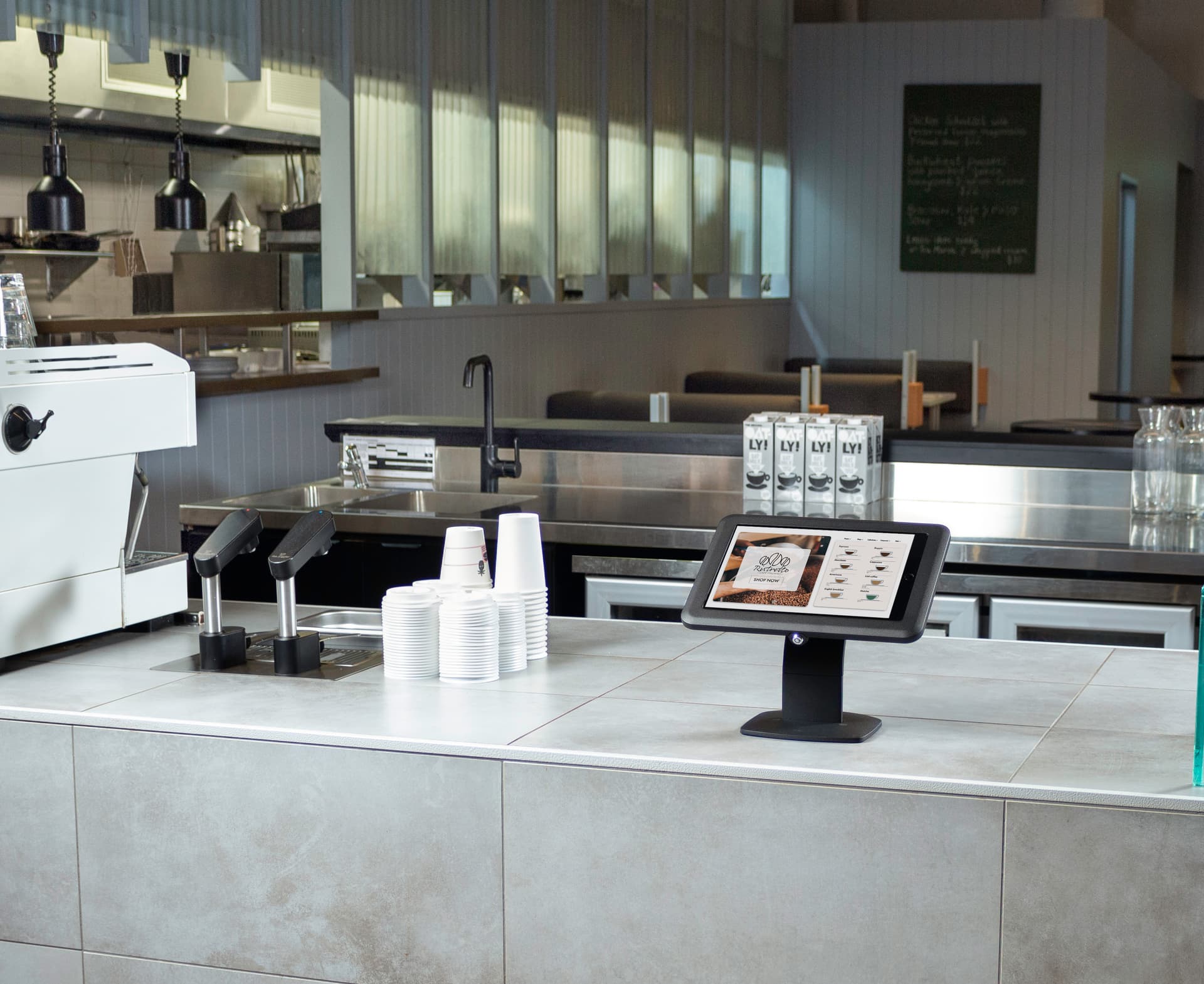 Desktop iPad holder being utilized as POS system in a coffee shop 