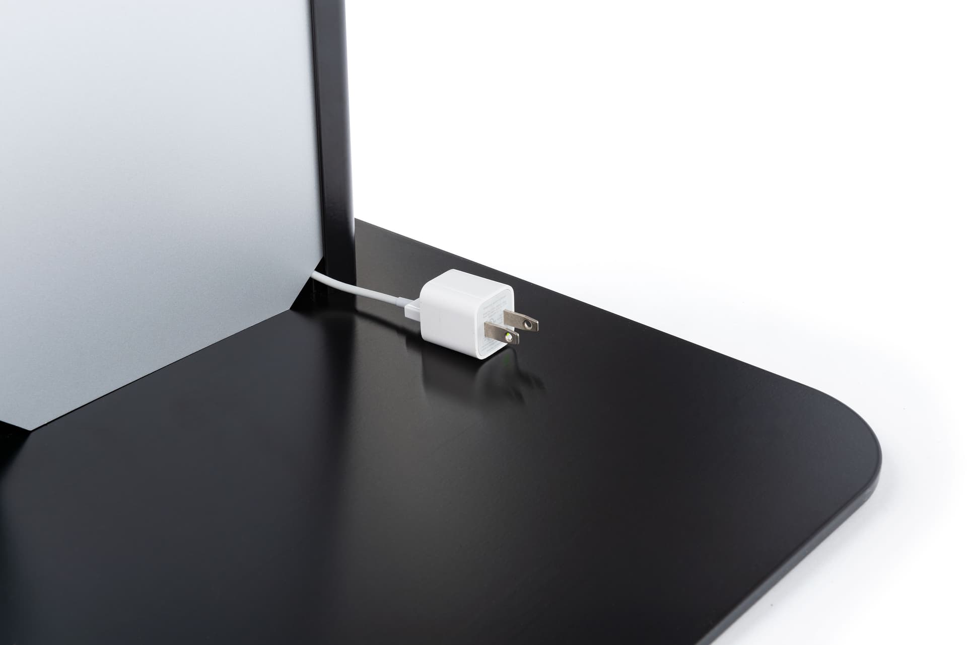 Black and silver brandable tablet kiosk with integrated cable management on back panel 