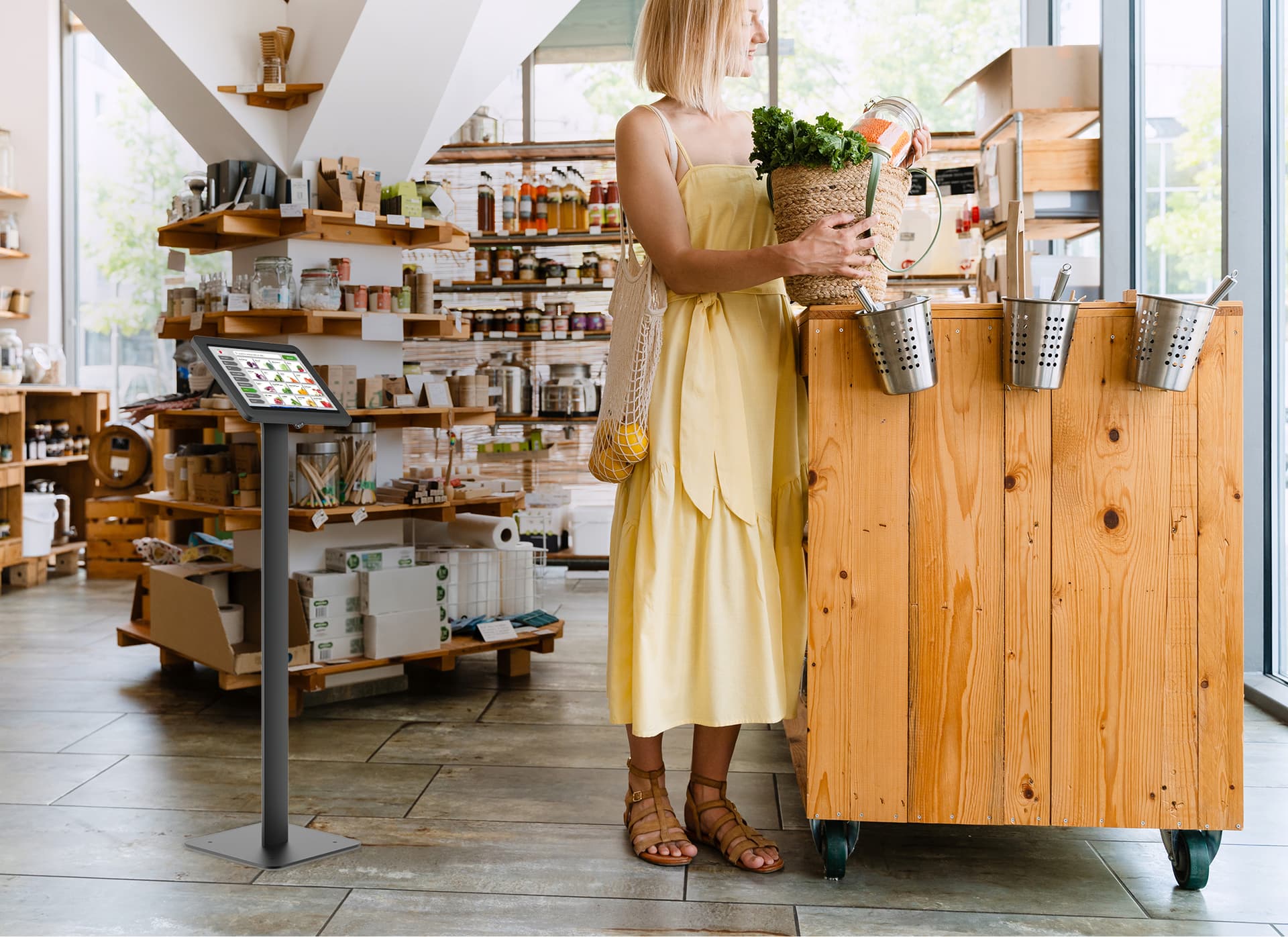 Floor standing Microsoft Surface tablet holder being utilized in a small boutique store as a POS system