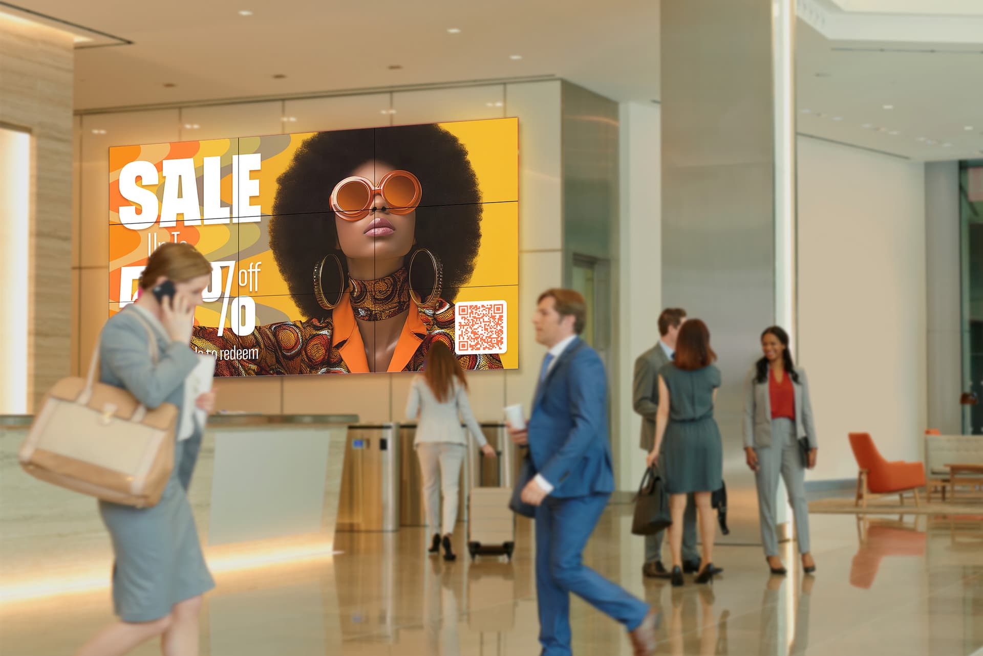 3x3 video wall being utilized in a public lobby space showcasing a retail clothing sale advertisement