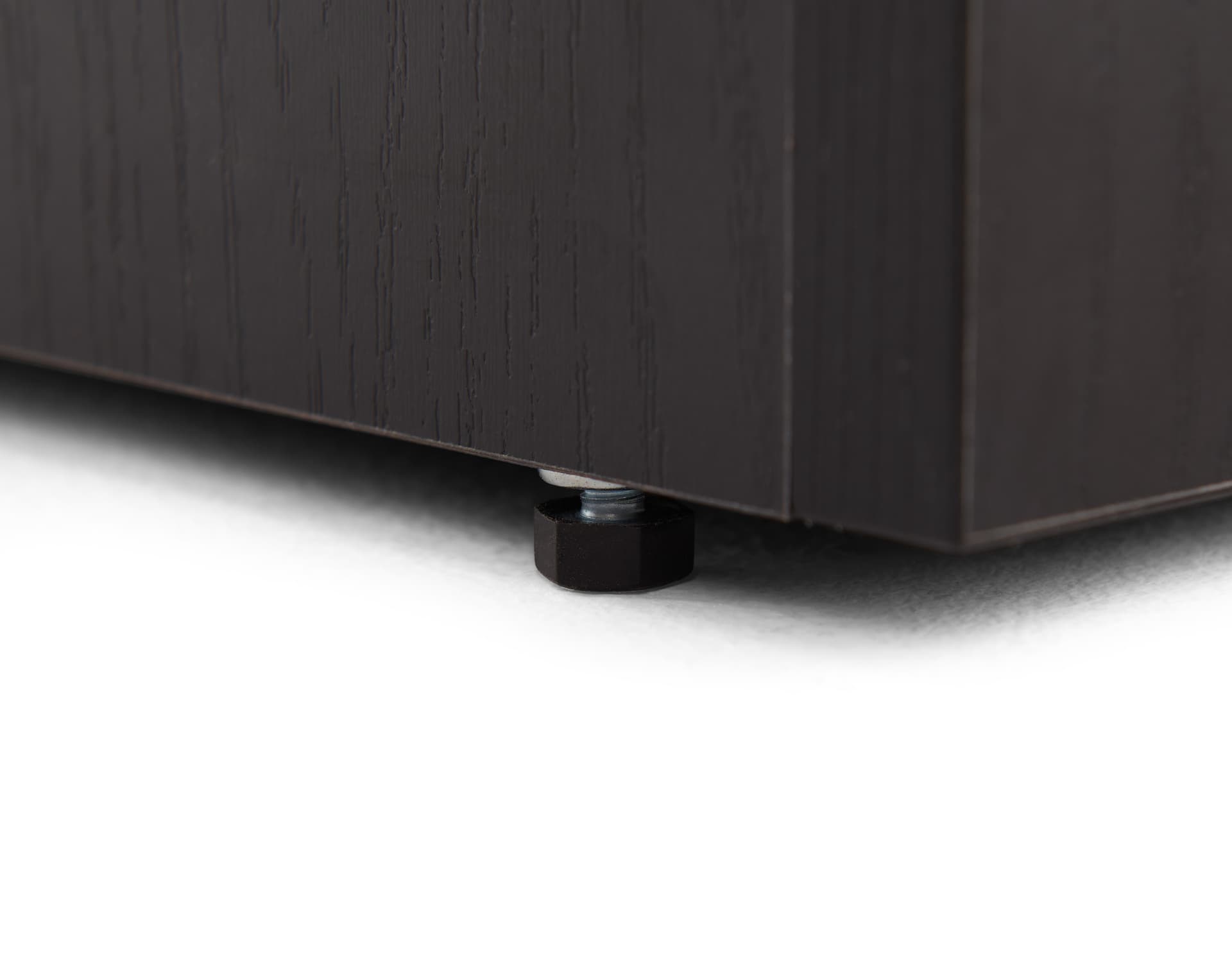 Pedestal showcase with adjustable levelers to ensure stability on uneven floor surfaces