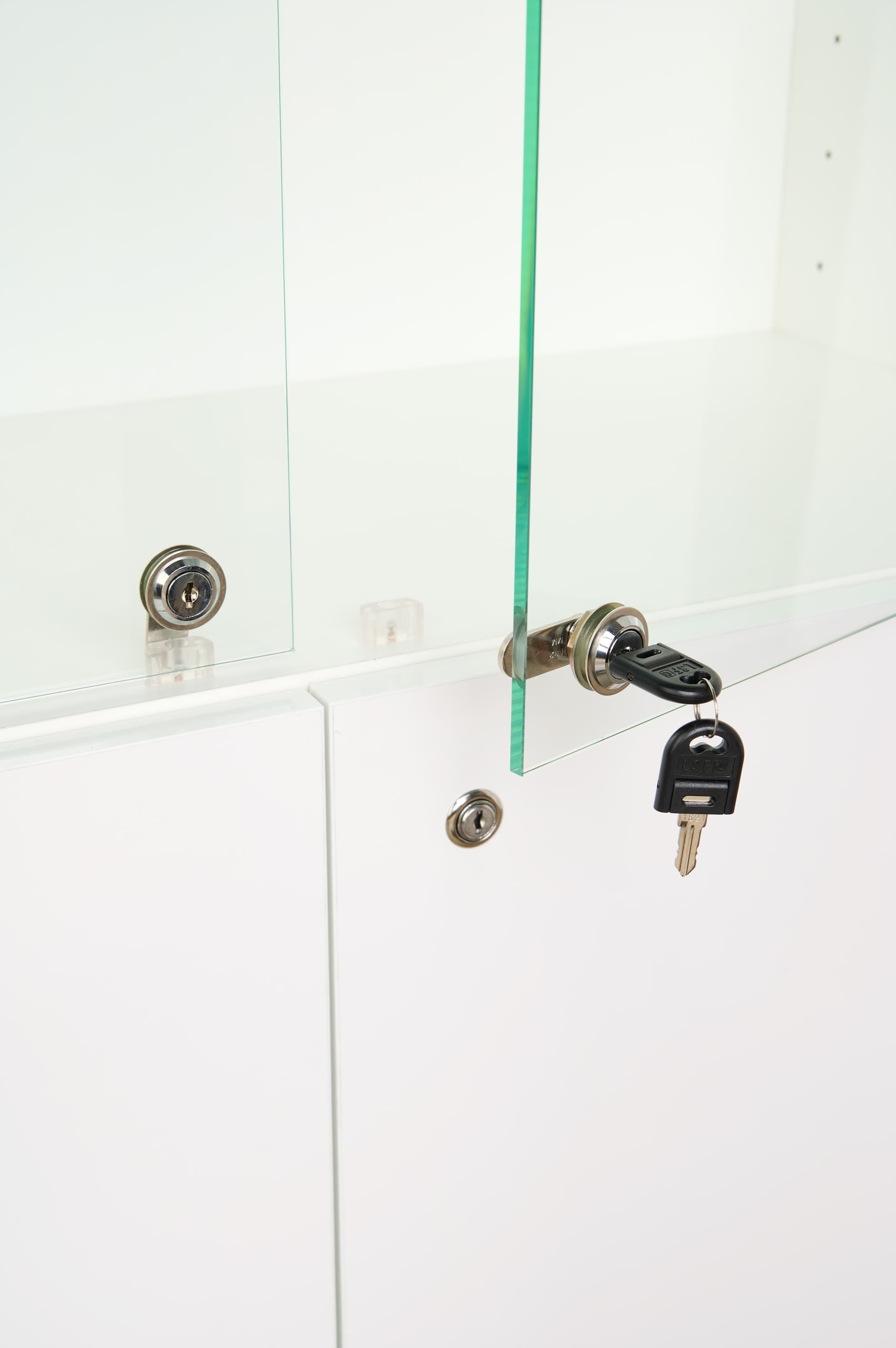 White display cabinet with glass doors and locking display area
