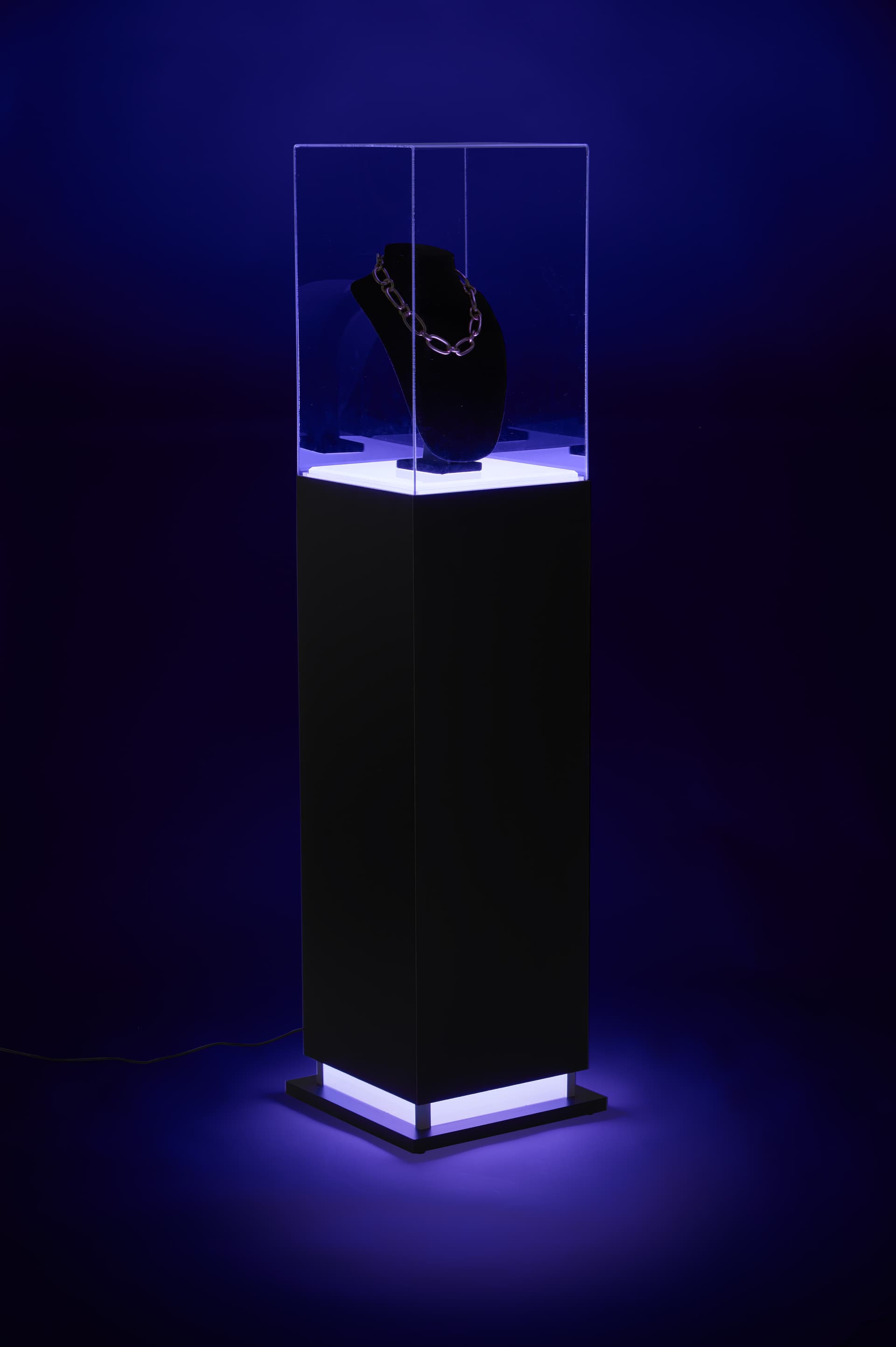 Pedestal display case with acrylic cover and illuminated display area and base