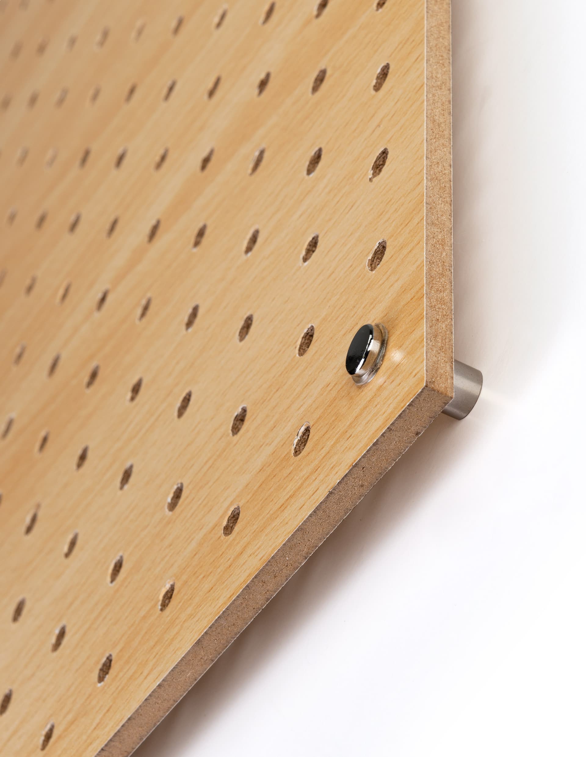 MDF pegboard retail display with silver standoffs