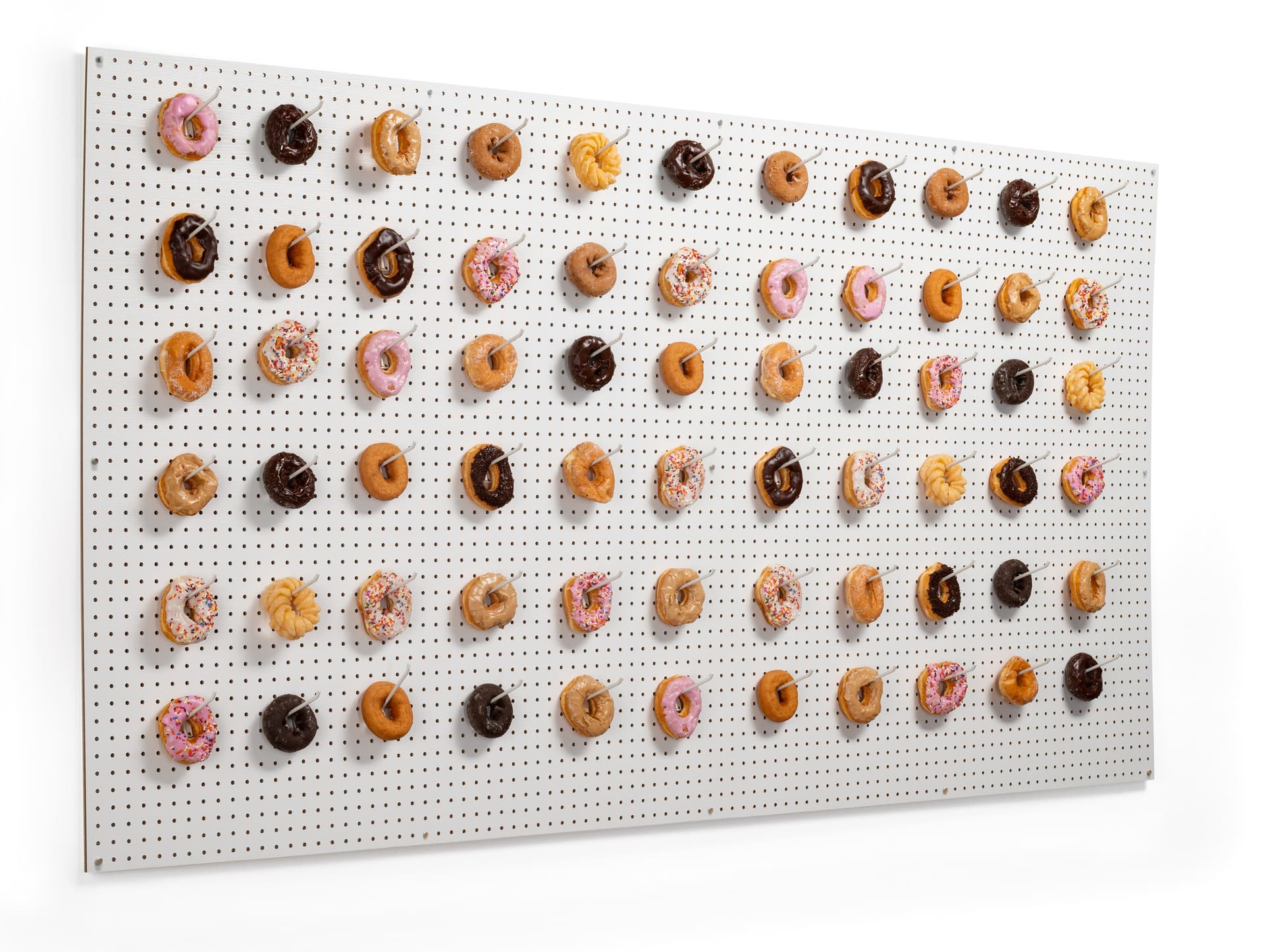 Wall-mounted large white pegboard