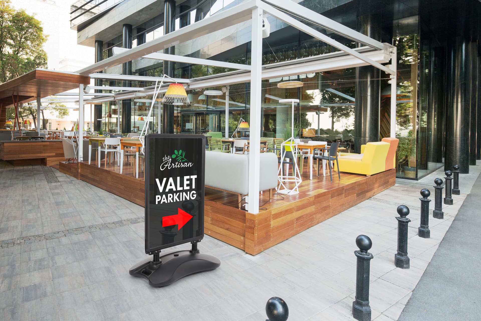 Free standing sign in front of a restaurant exhibiting a valet parking graphic 