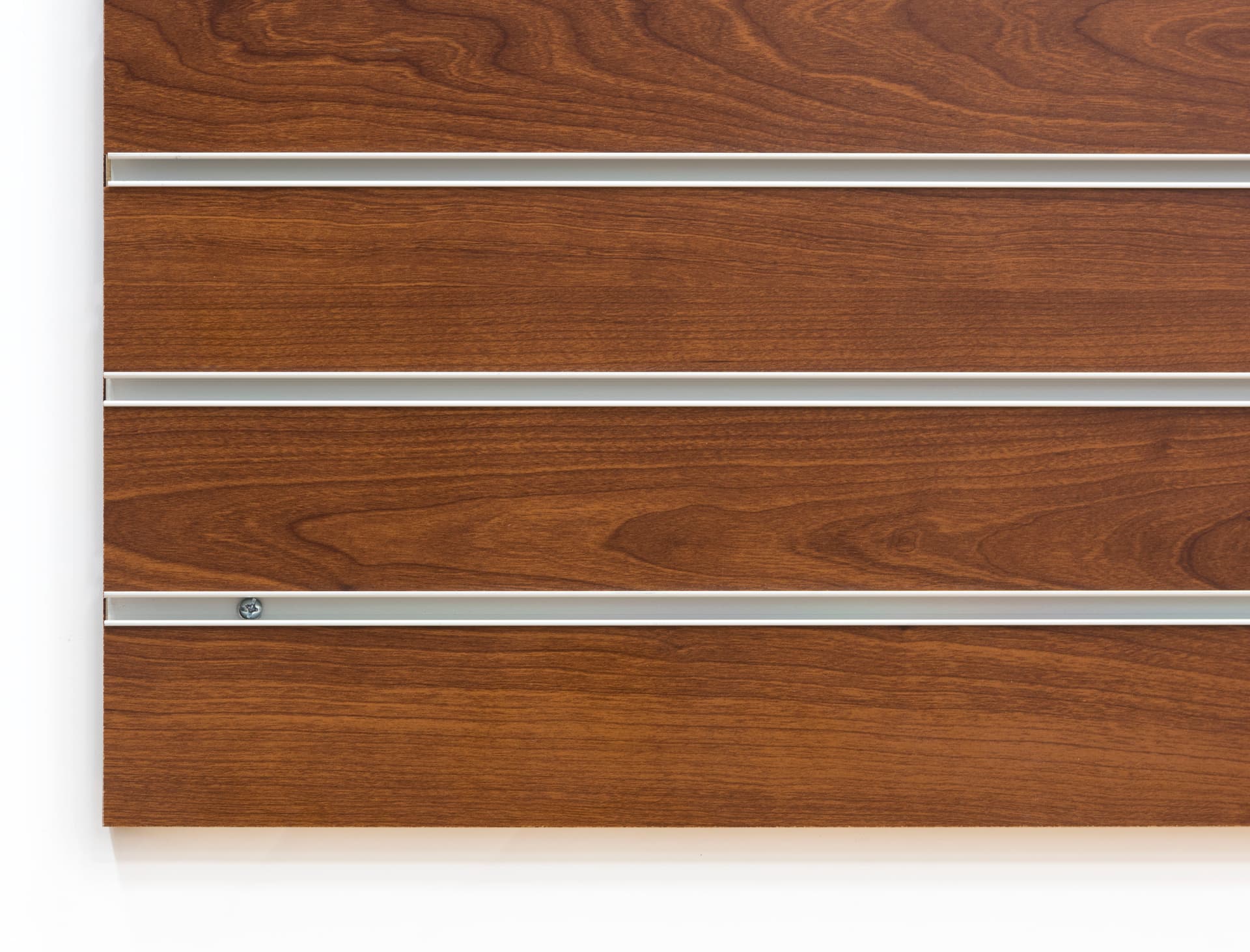Close Up of  Edge of Cherry Finish Large Slotted Wall Board Panel