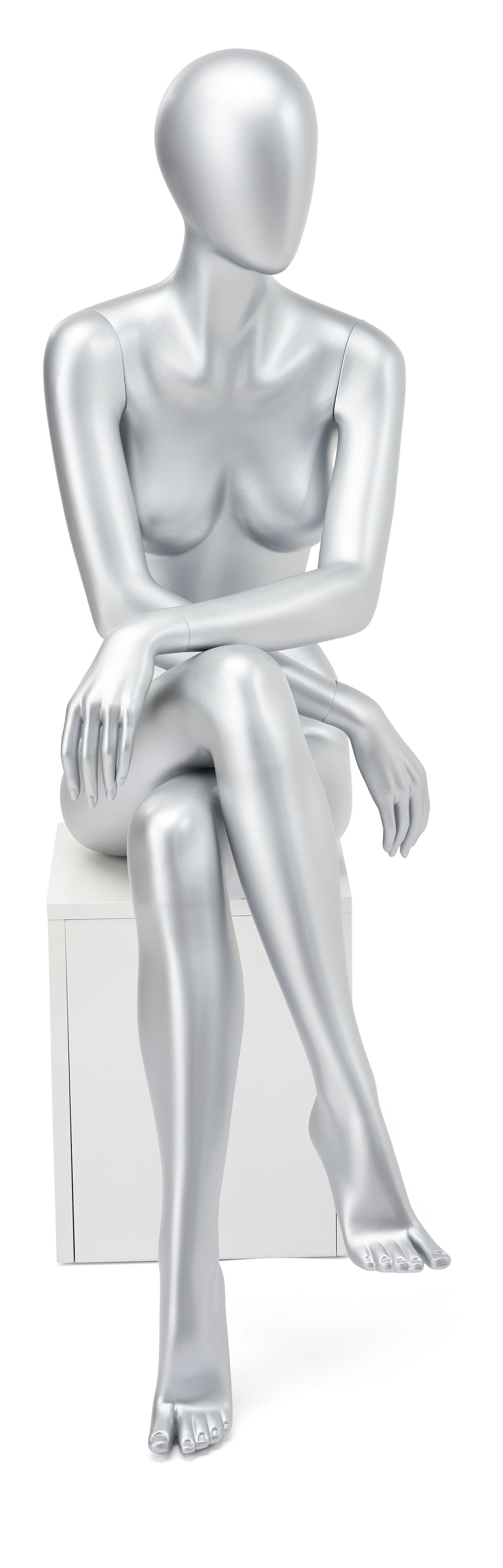 Abstract seated female mannequin with relaxed pose 