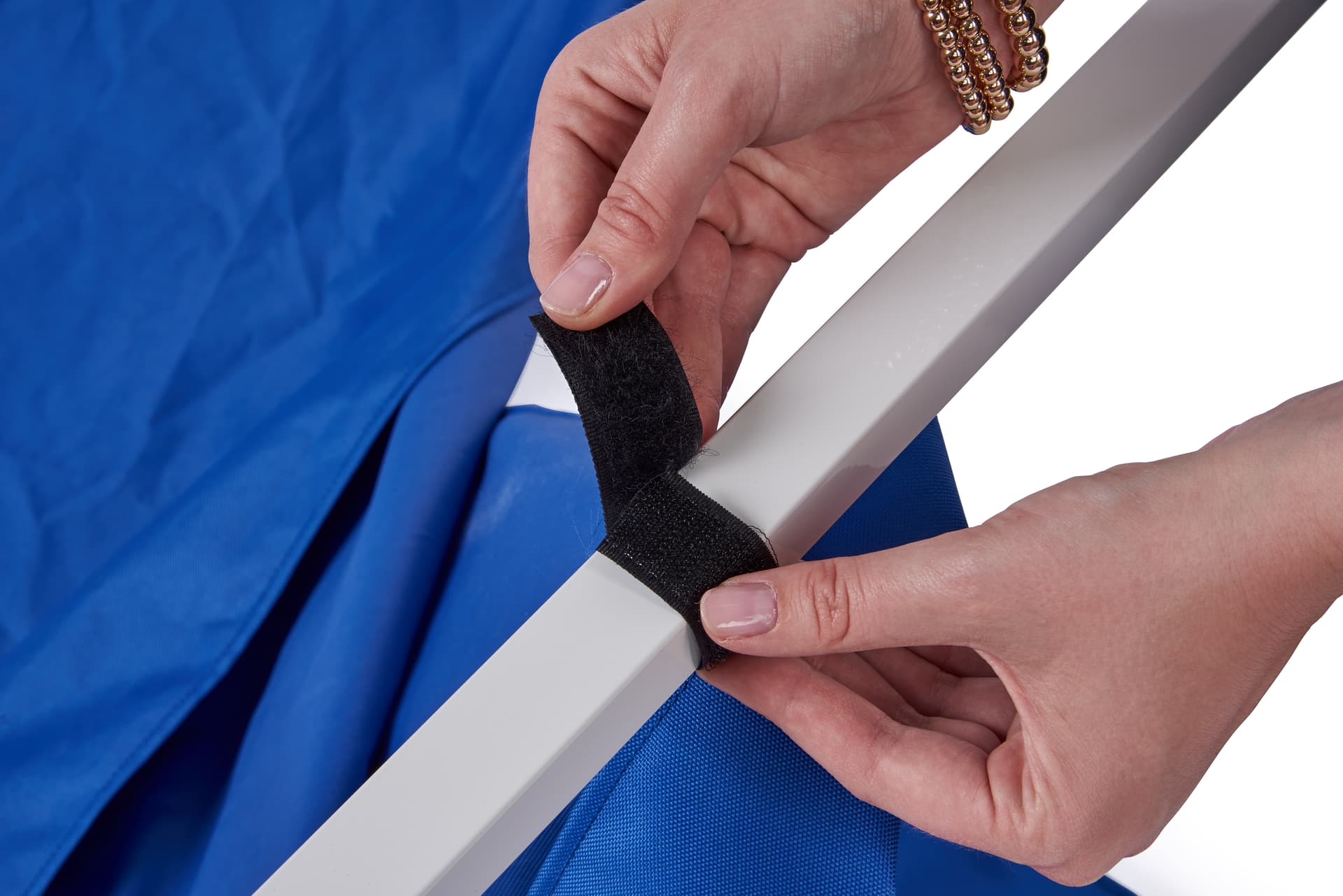Table top canopy with hook and loop fasteners to secure awning