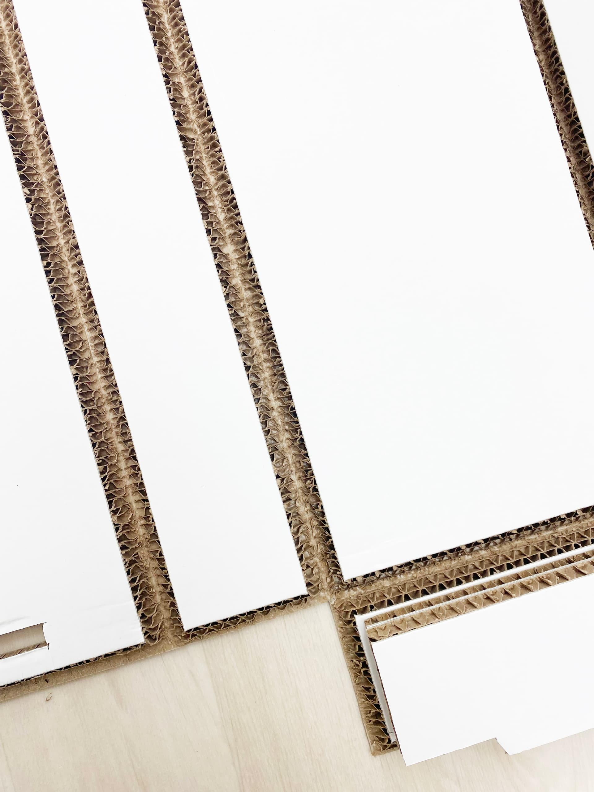 Eco-friendly booth backwall with unique v-groove cuts for simple construction 