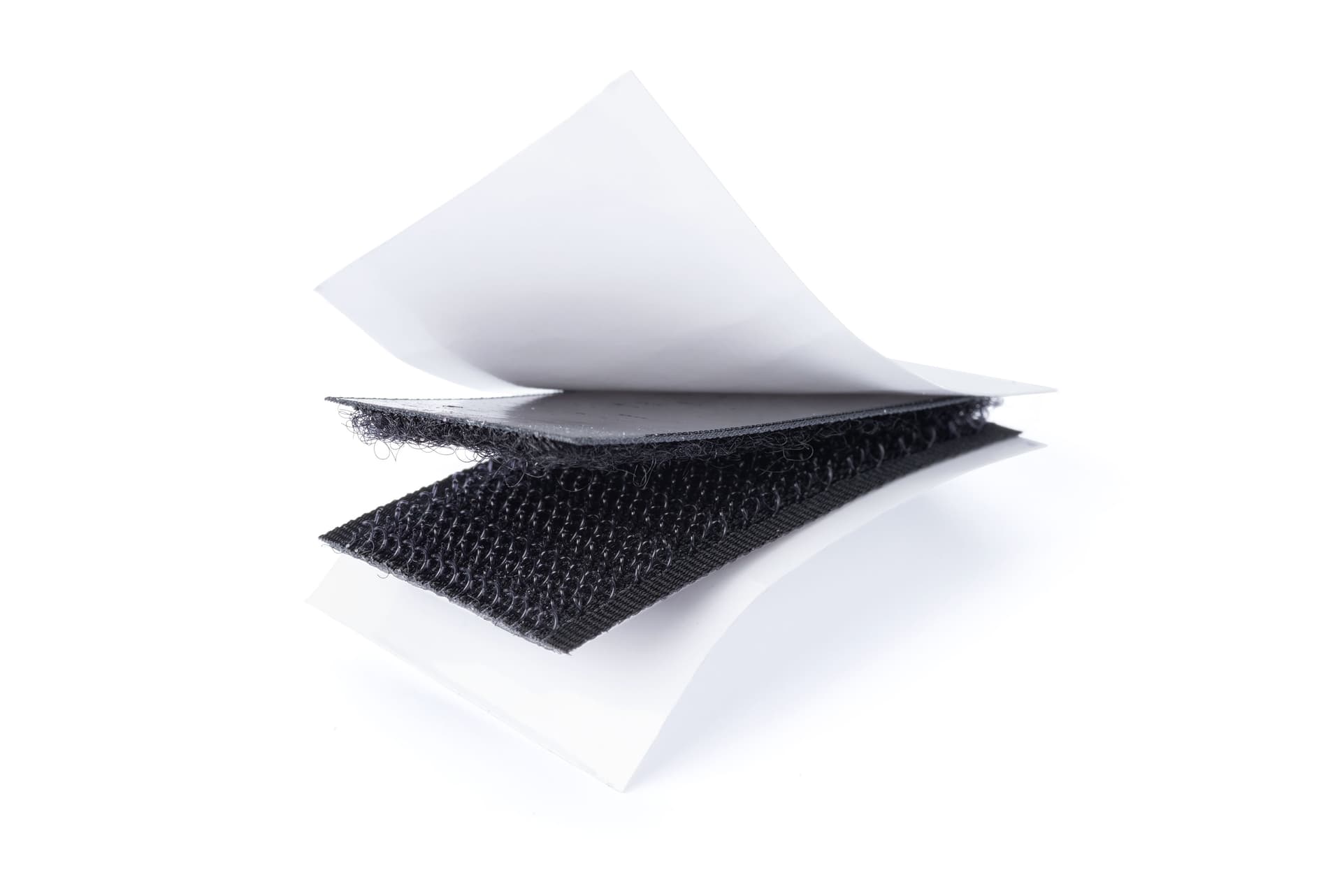 Hook and loop strips with adhesive backing