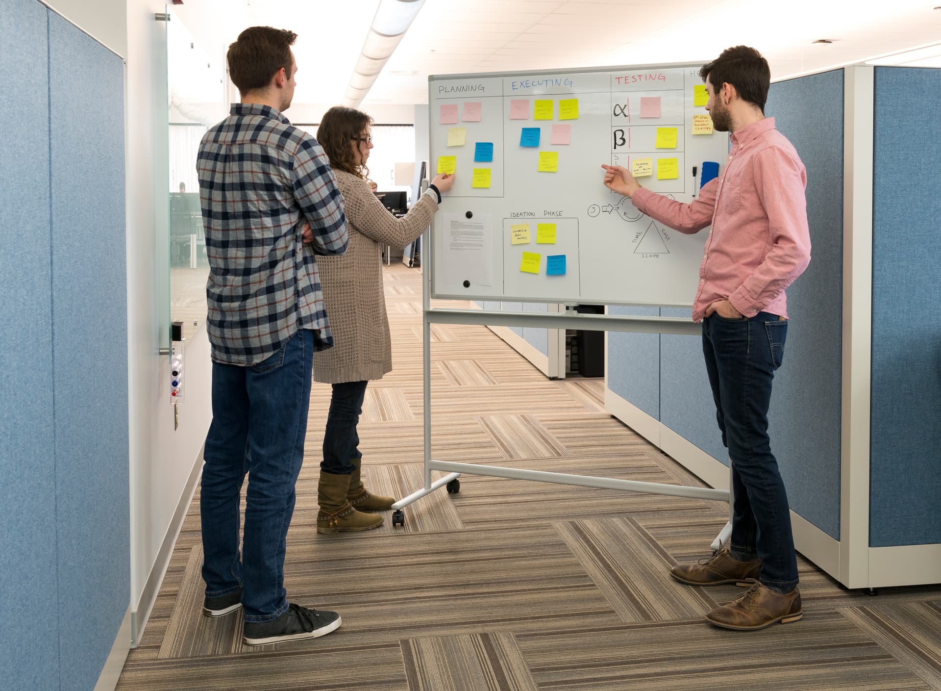 Rolling whiteboard for stand-up meeting