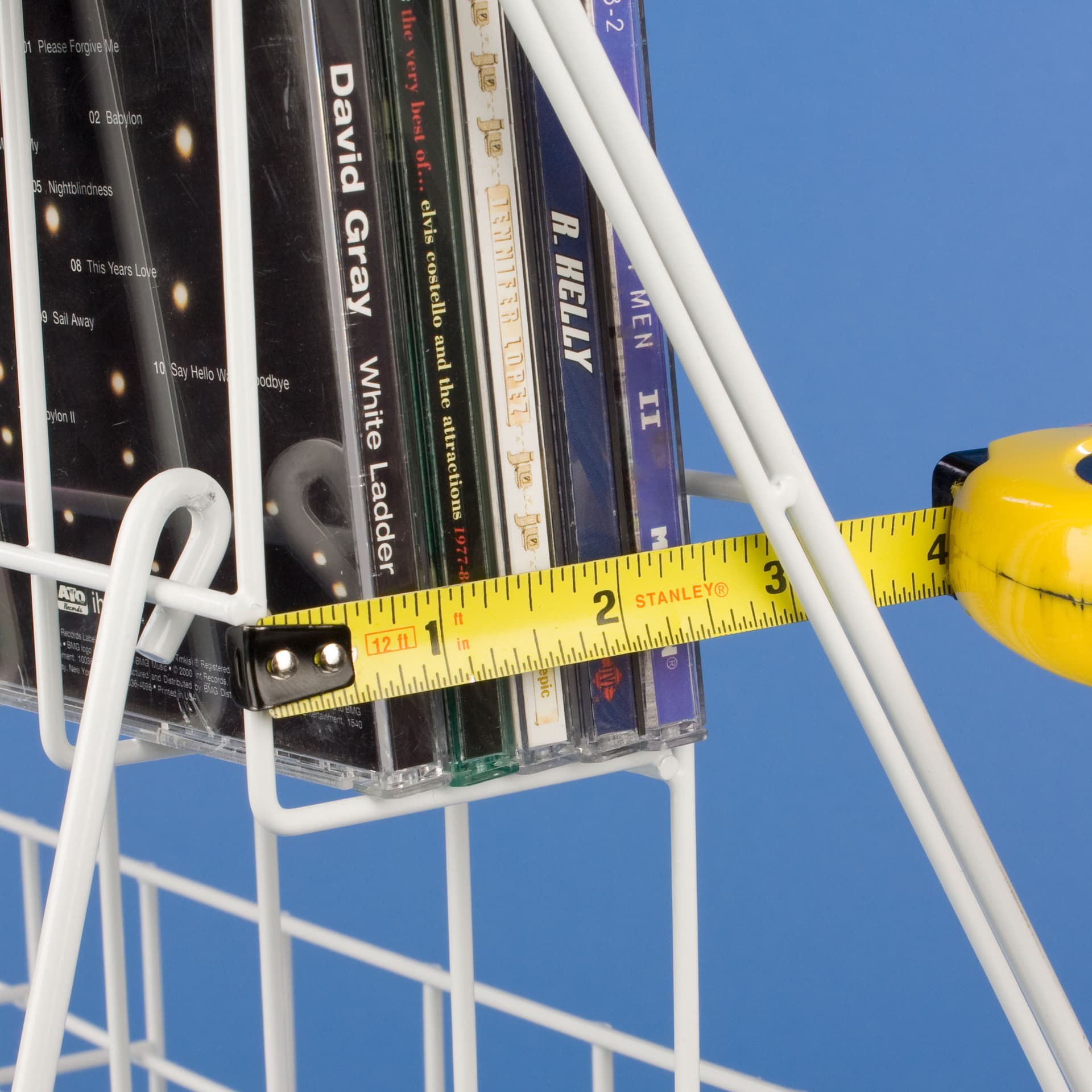 White Wire Magazine Rack that Holds Signage