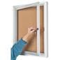 This enclosed aluminum bulletin board includes a set of keys