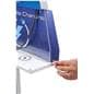 Standoff graphic being inserted behind acrylic frame on cell phone charging station