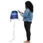 Person using wall mounted cell phone charging station