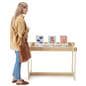 Wooden retail dump table stands 30 inches tall and has a width of 44 inches