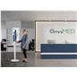 Digital charging station with the charging station being used by an individual in a medical facility showcasing a hospital advertisement on the screen