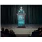 Digital podium being utilized in an auditorium during a graduation ceremony