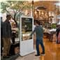 Interactive Digital Display with a unit being displayed in a store where customers can also browse sites via there digital signage units