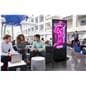 Advertising multimedia kiosk being used at a university common area displaying a volleyball intramural graphic