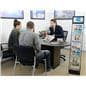 Digital screen brochure stand shown in travel agency