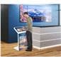 Floor standing touch screen kiosk being used in an airport check in space