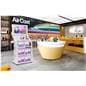 Product display shelves being utilized in a tech store showcasing a product highlight video on the screen