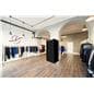 Pop-up black dressing room booth in retail environment